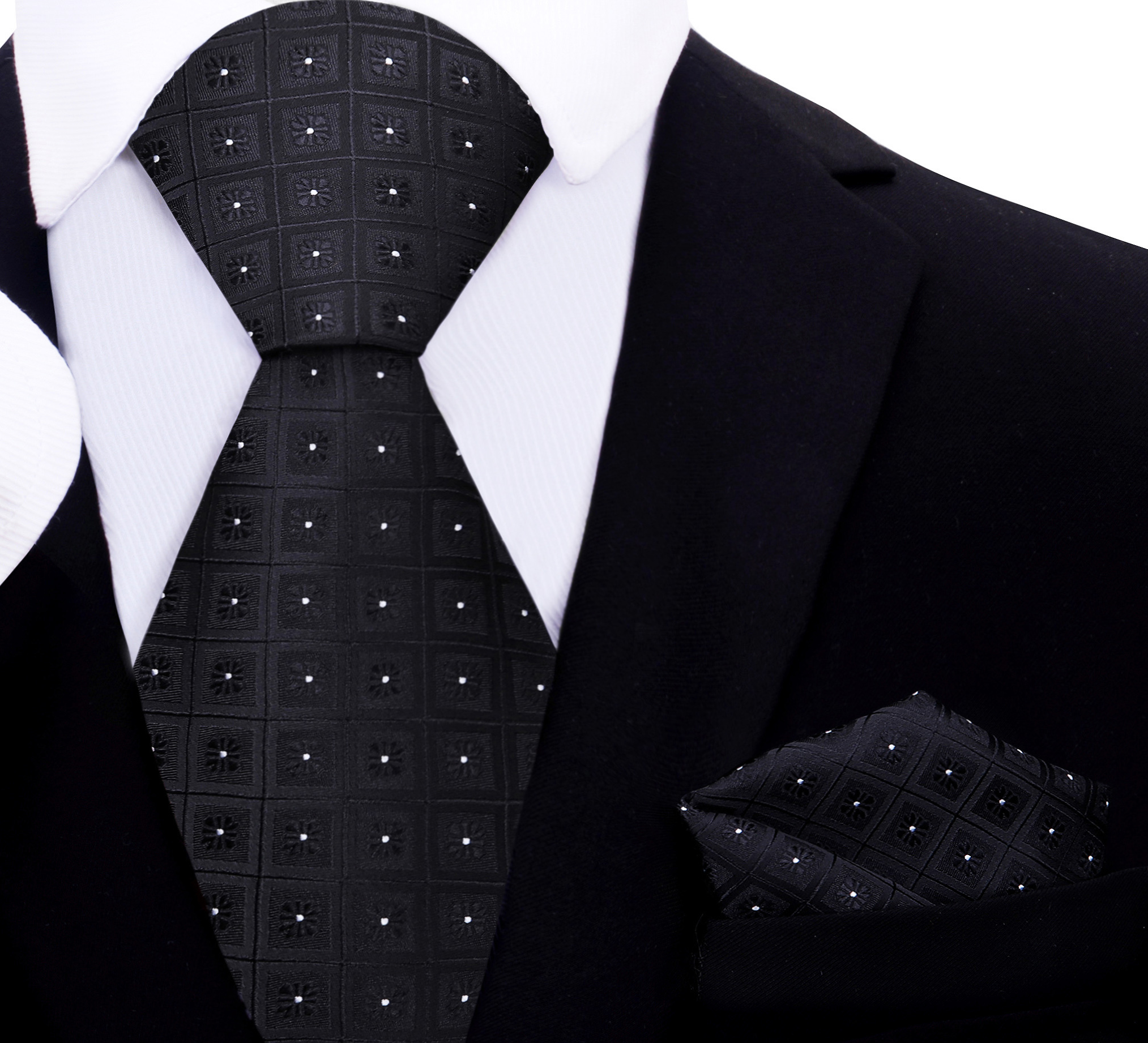 Flat lay of the black geometric necktie alongside a coordinating pocket square.