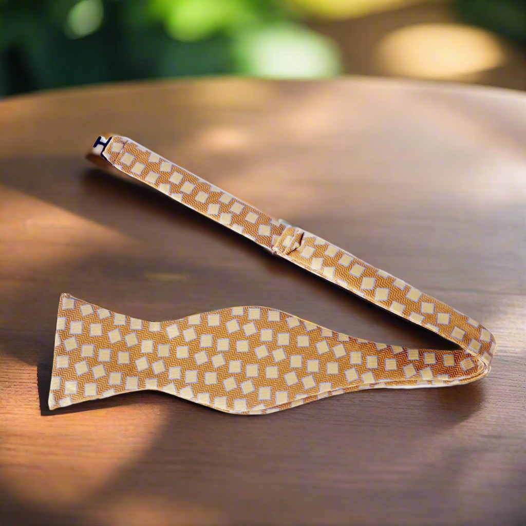Luxury mens bow tie with pocket square, elegantly folded and styled for a formal occasion.