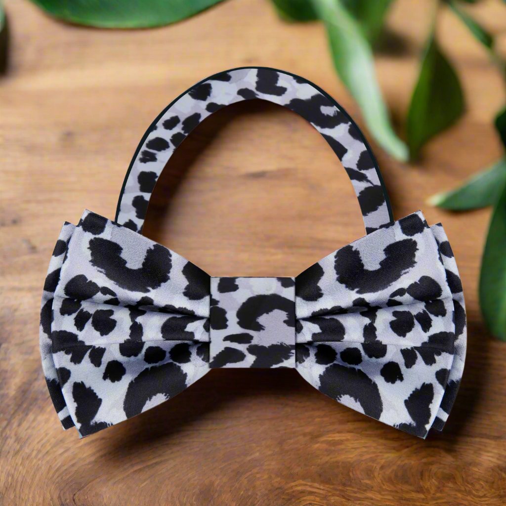 Mens bow tie featuring a bold cheetah print, perfect for weddings and parties