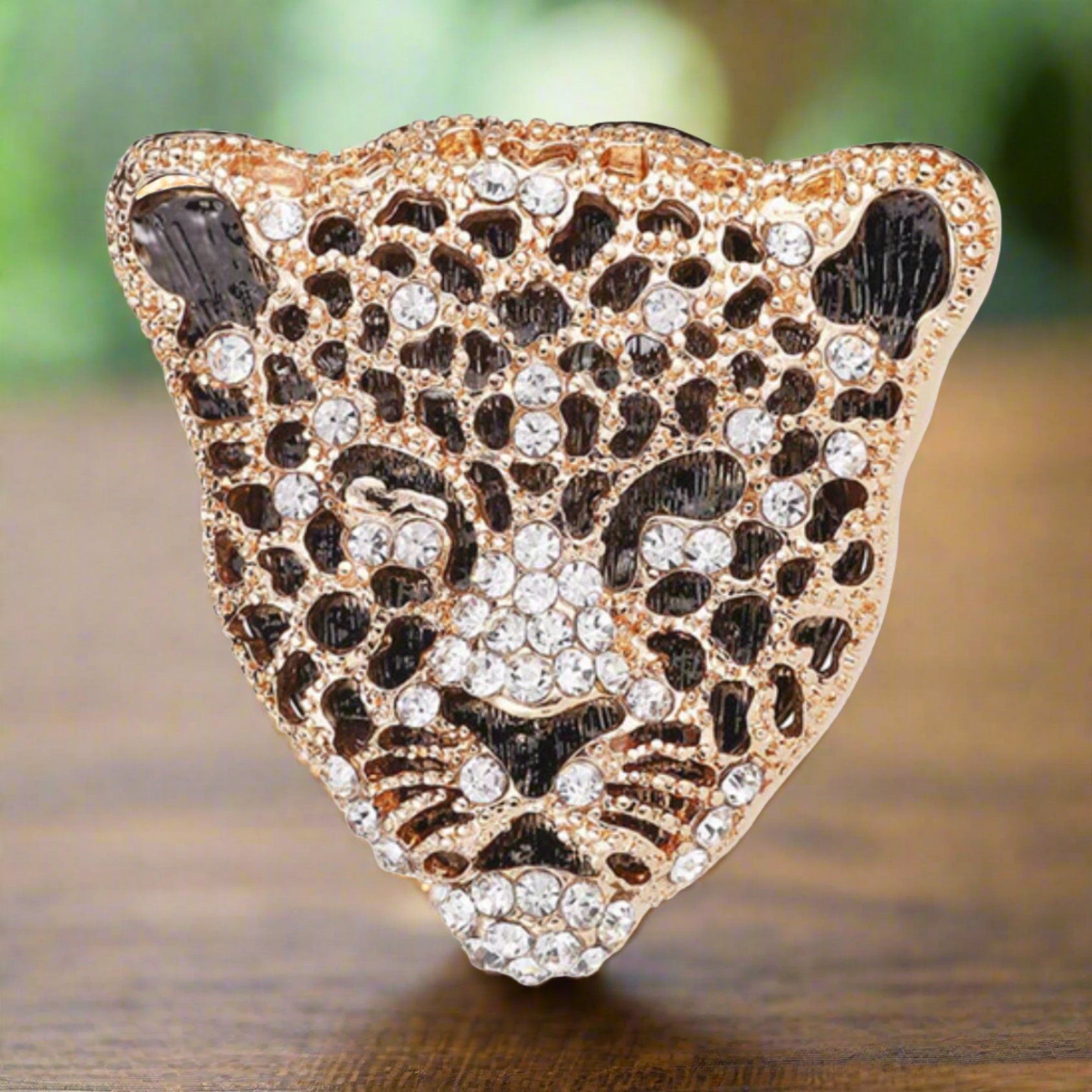 Front view of a gemstone exotic animal lapel pin with lion design, showcasing intricate detail and sparkling gemstones