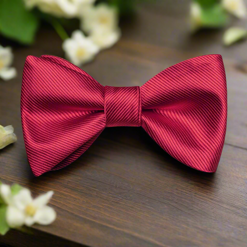 Classic solid color bow tie in royal blue, perfect for formal events.