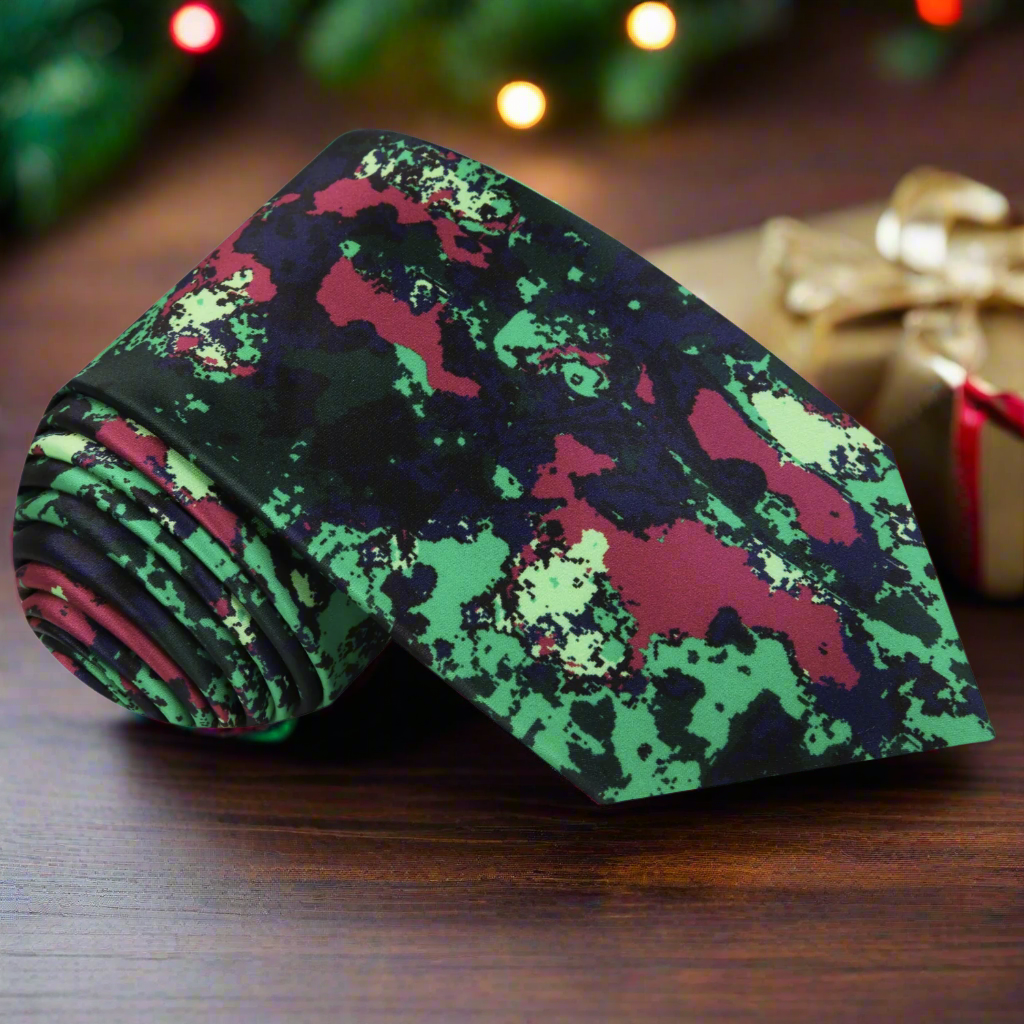 Close-up of abstract inkblot silk tie in red and green for holiday parties