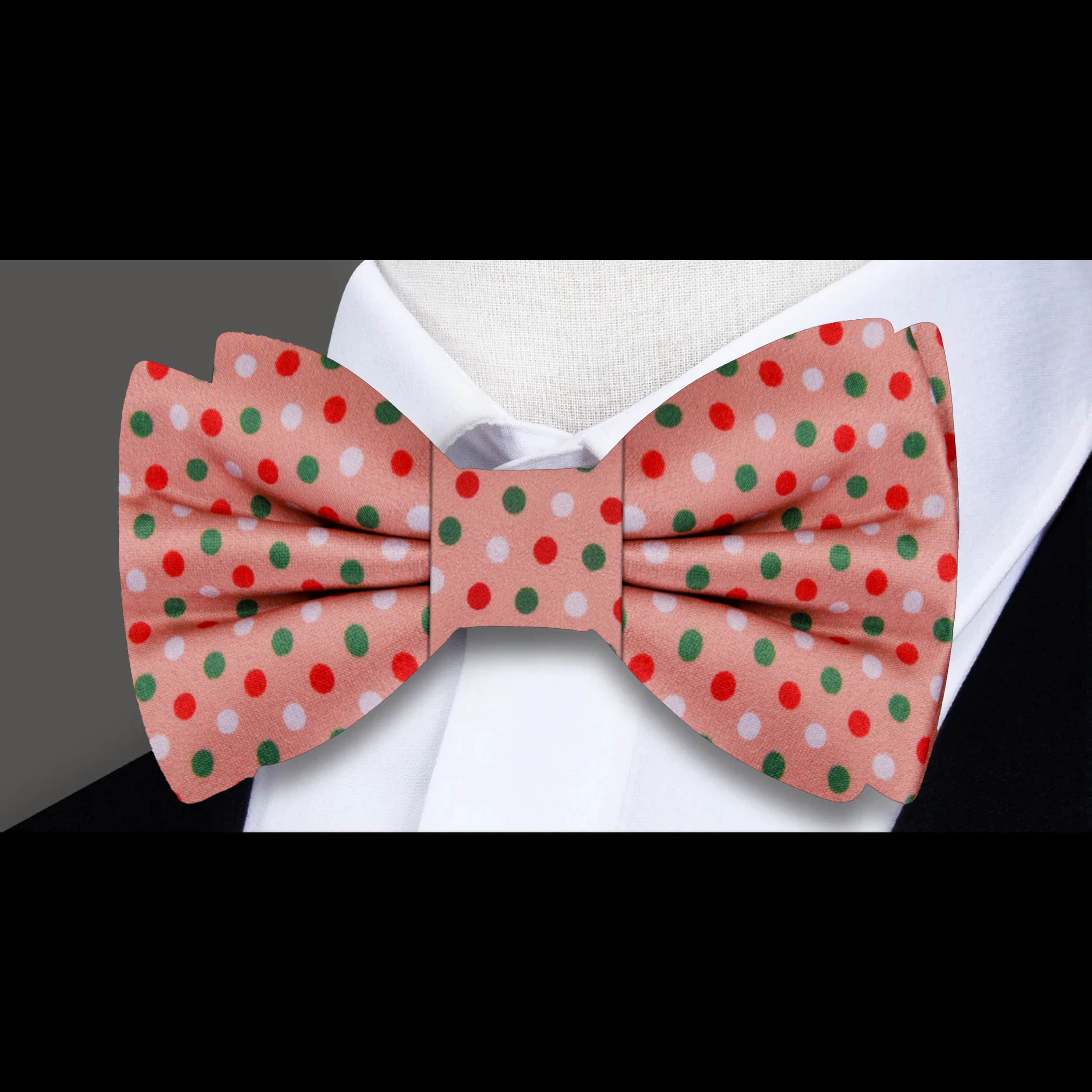 Close-up of the festive polka dot silk bow tie showcasing its vibrant colors and fabric quality.