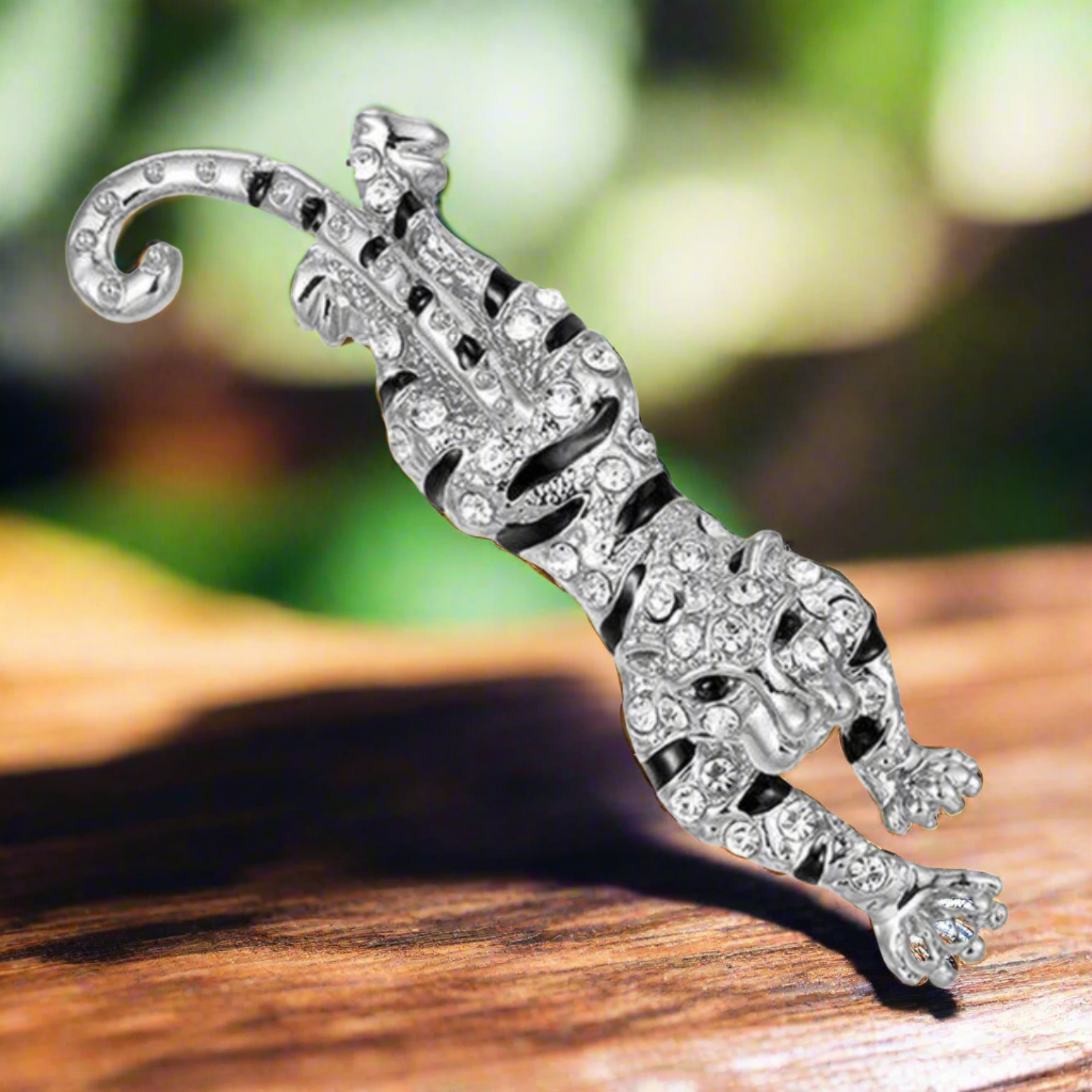 Close-up of a gemstone lion lapel pin with detailed craftsmanship
