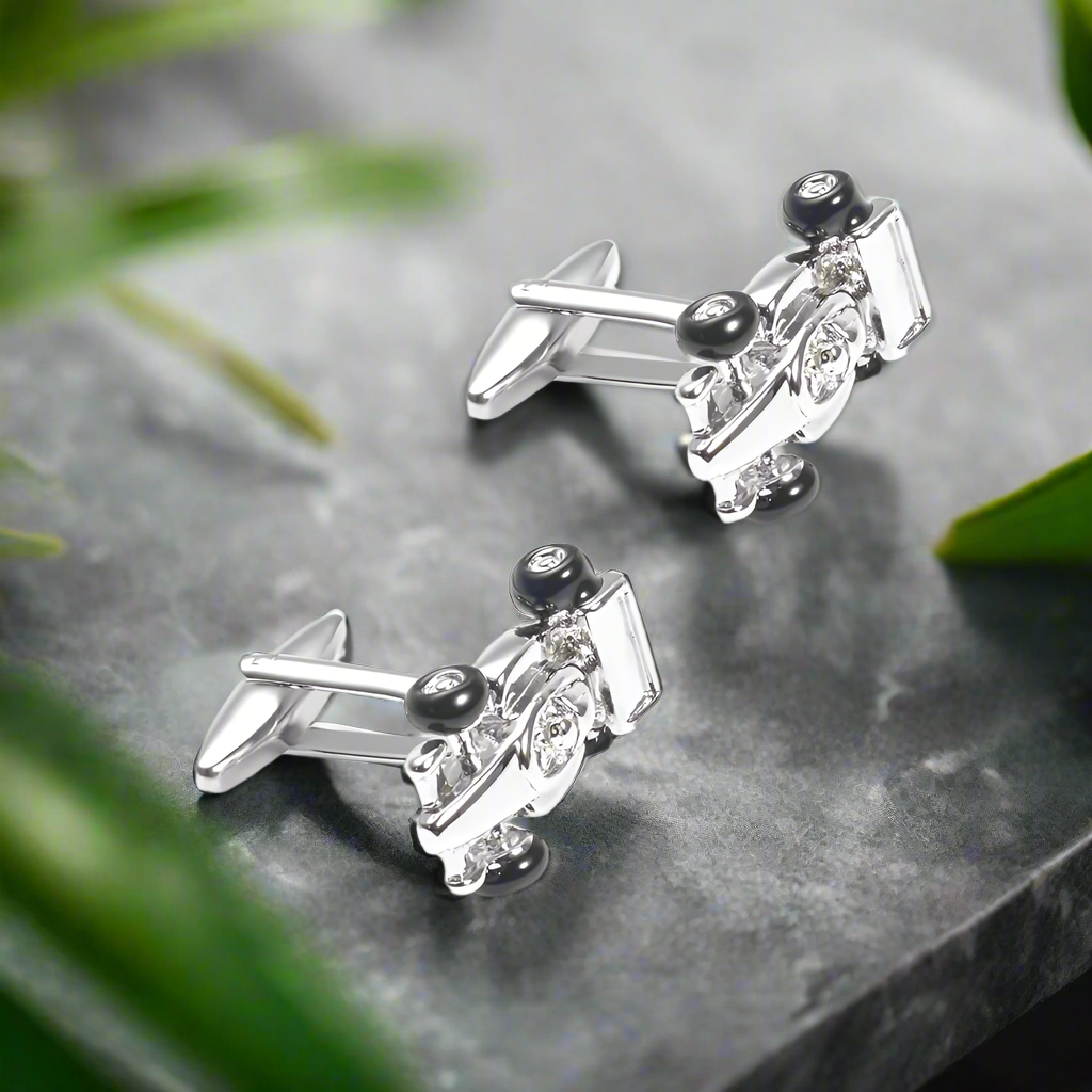 Side view of race car cufflinks with chrome and red accents, ideal for automotive enthusiasts