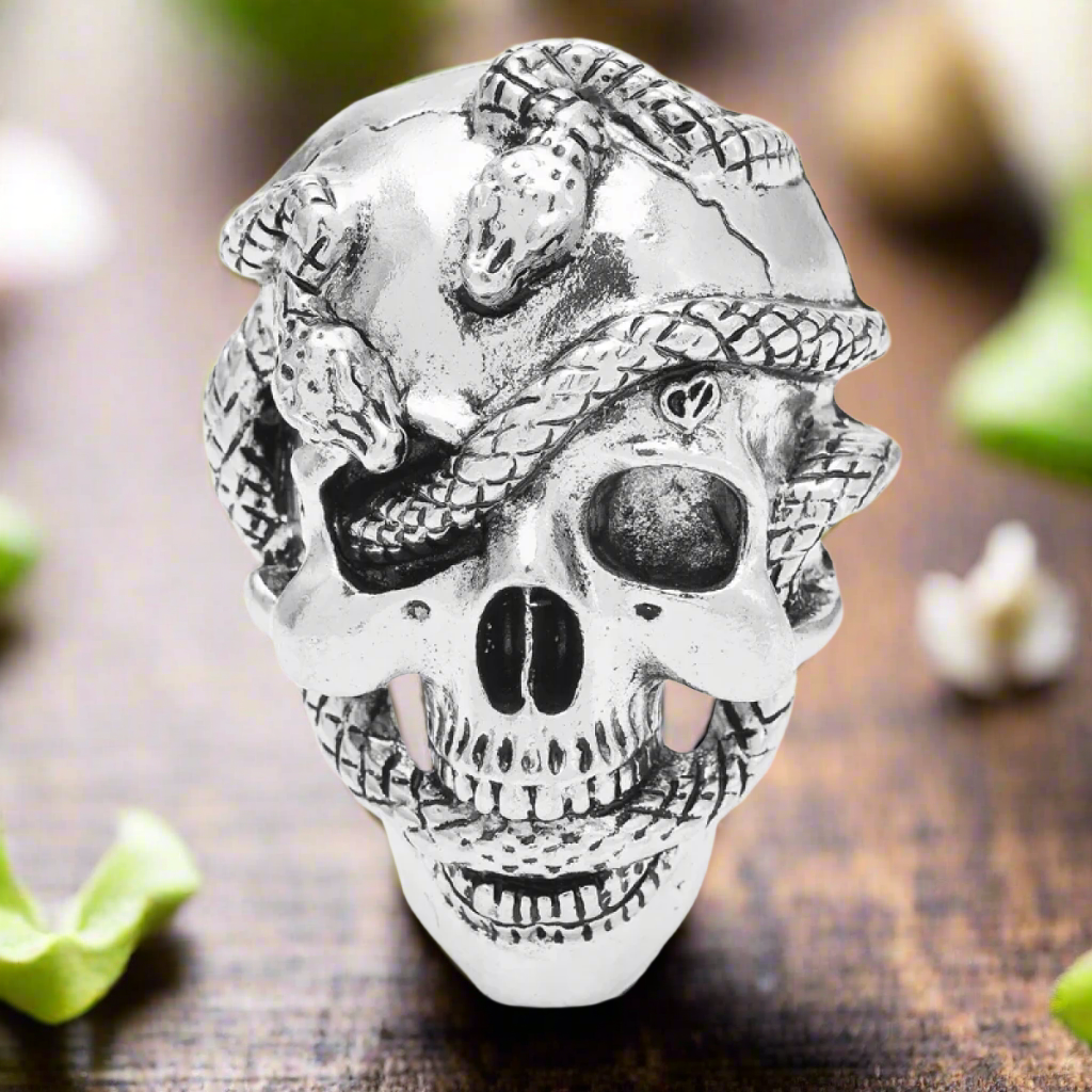 Mens skull lapel pin worn on a black suit, adding a touch of elegance and edge.