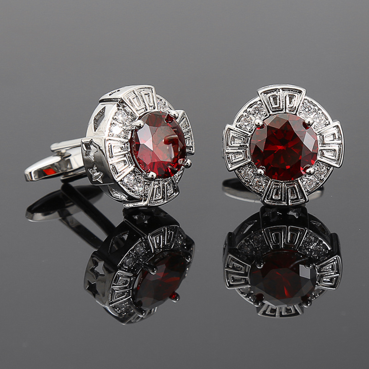 Close-up of chrome cufflinks showcasing vibrant glass accents