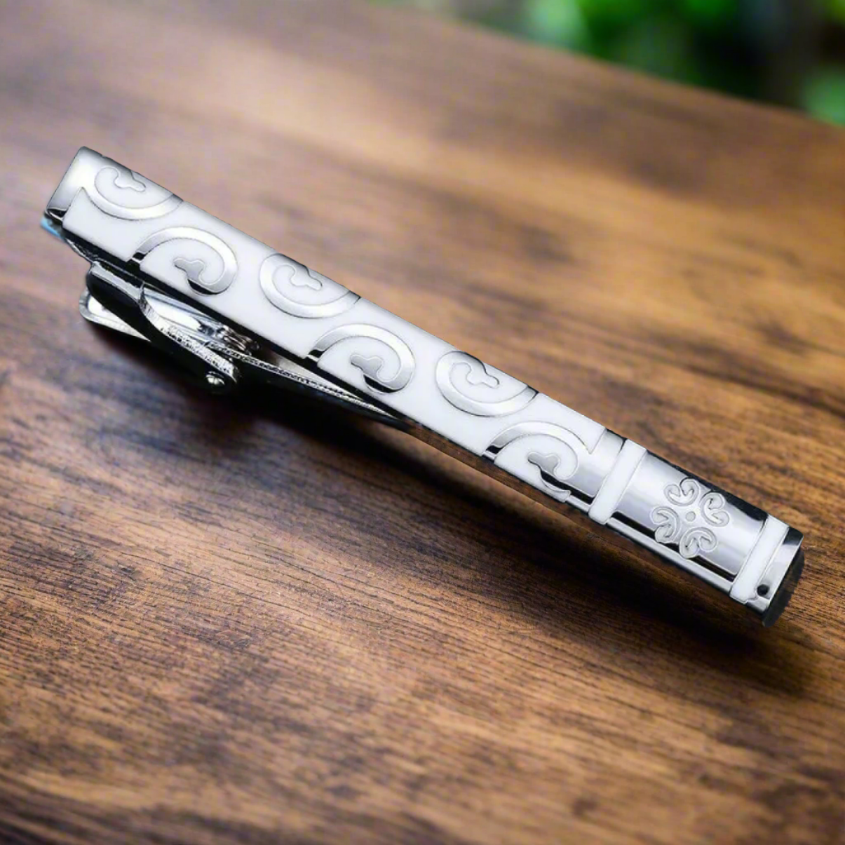 Gold checkerboard tie bar, adding a touch of modern elegance to mens dress accessories.