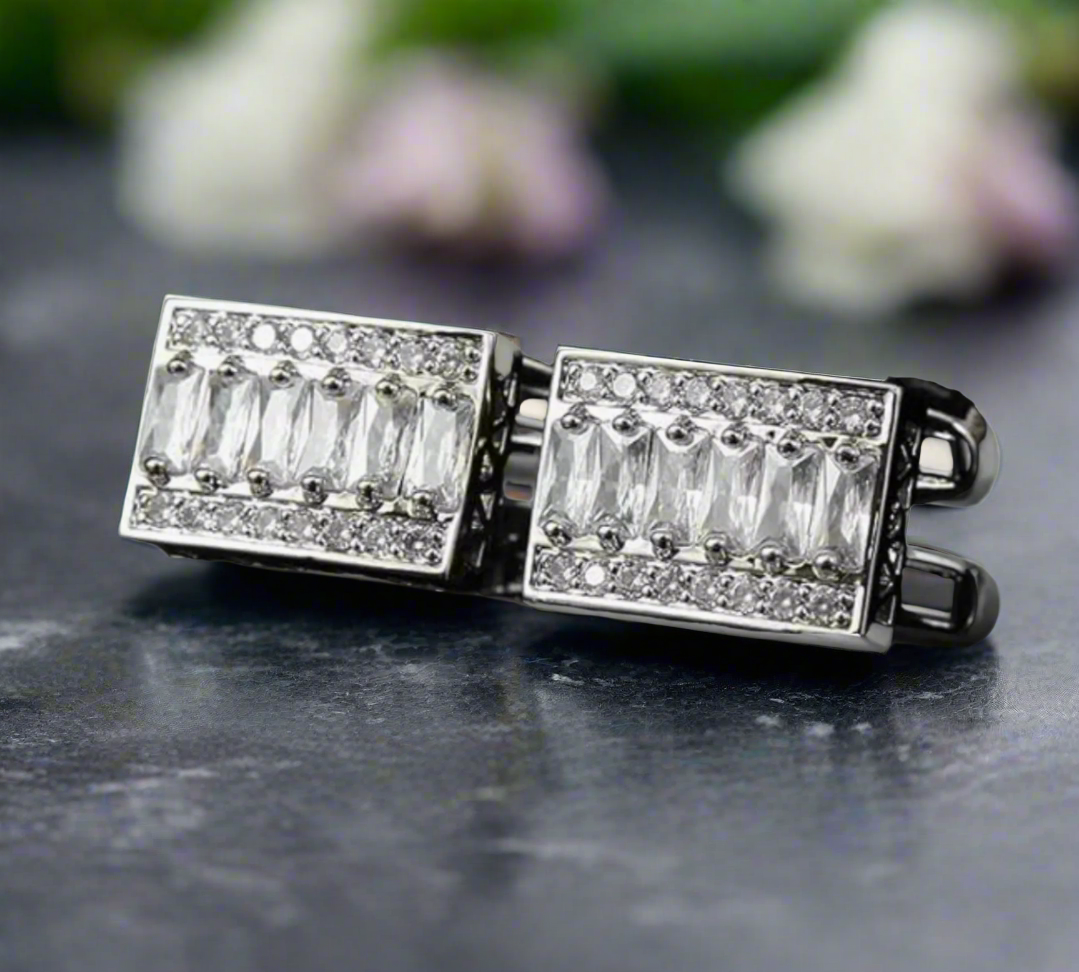 Close-up of chrome cufflinks on a dress shirt cuff