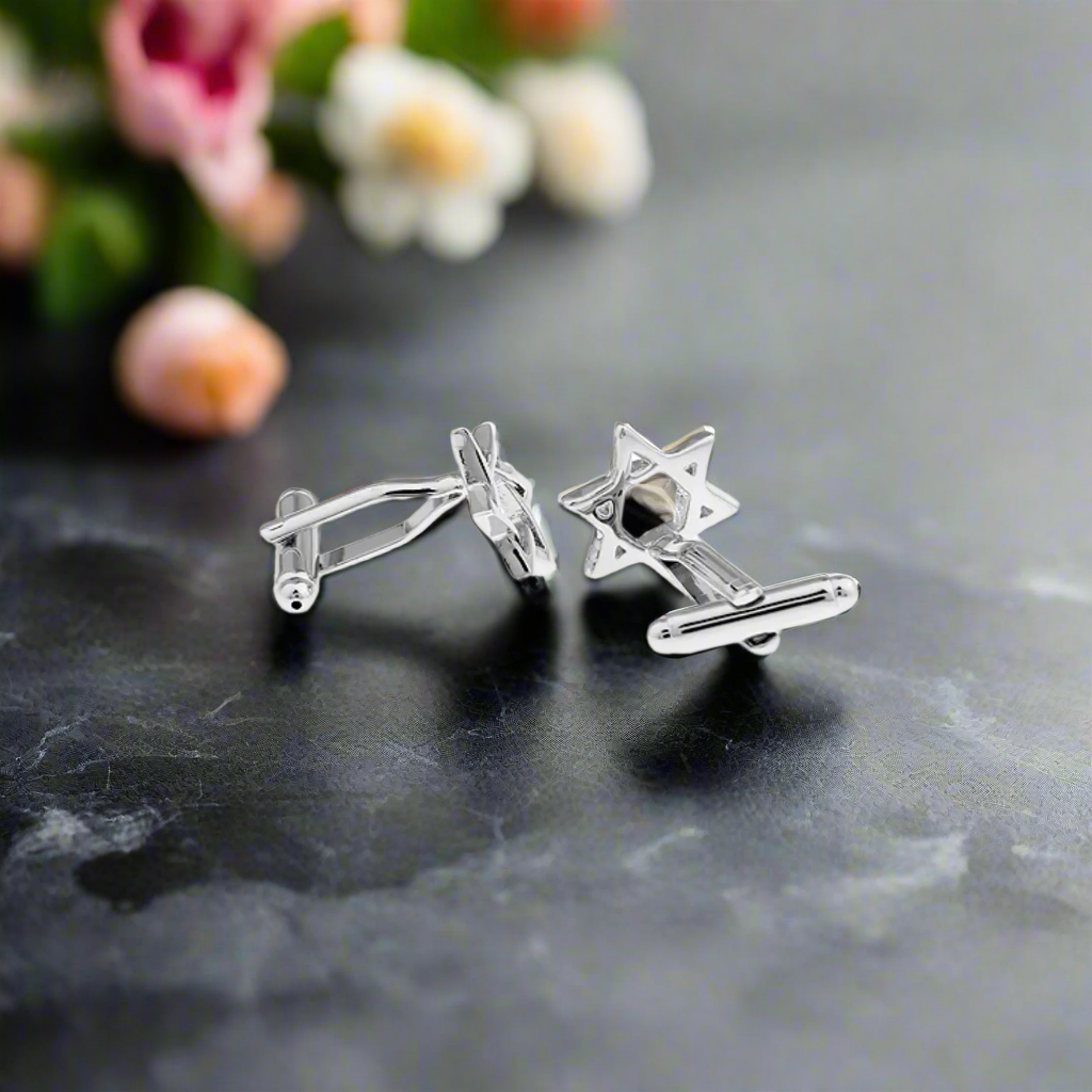 Close-up view of the chrome Star of David cufflinks, highlighting their square shape and unique detailing, ideal for formal wear.