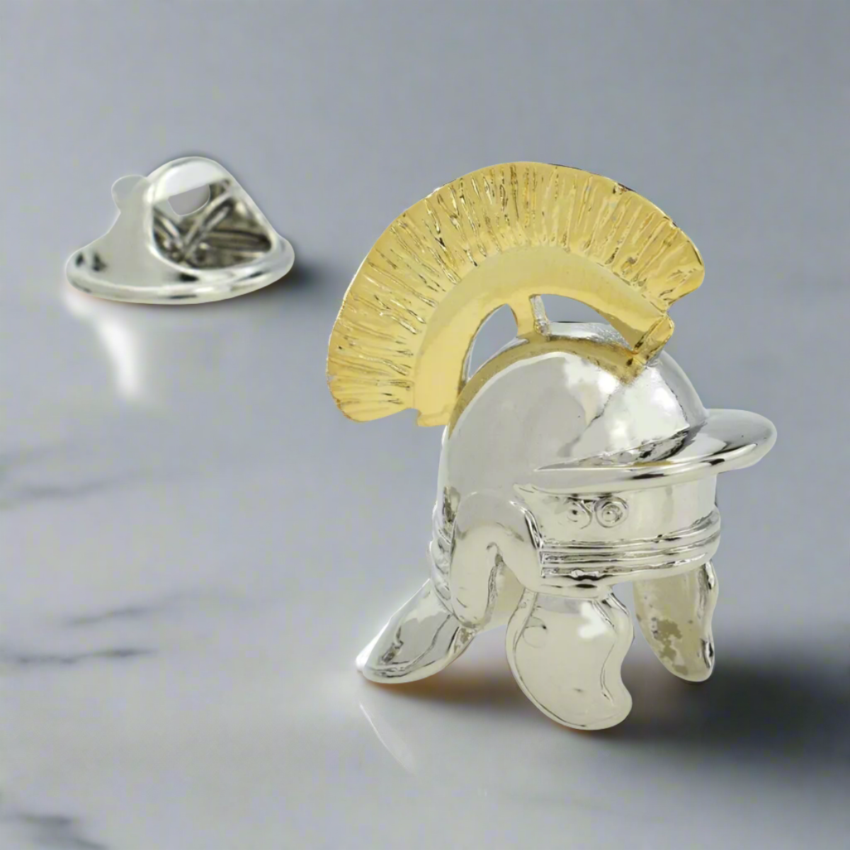 Vintage Roman helmet lapel pin on a white dress shirt for a stylish look