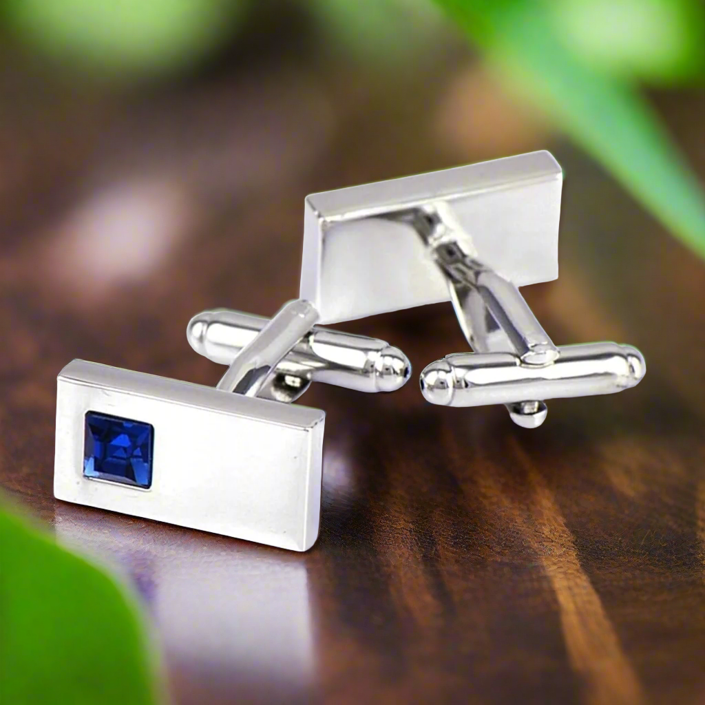 Close-up of the chrome tie bar showcasing small rectangle stones.