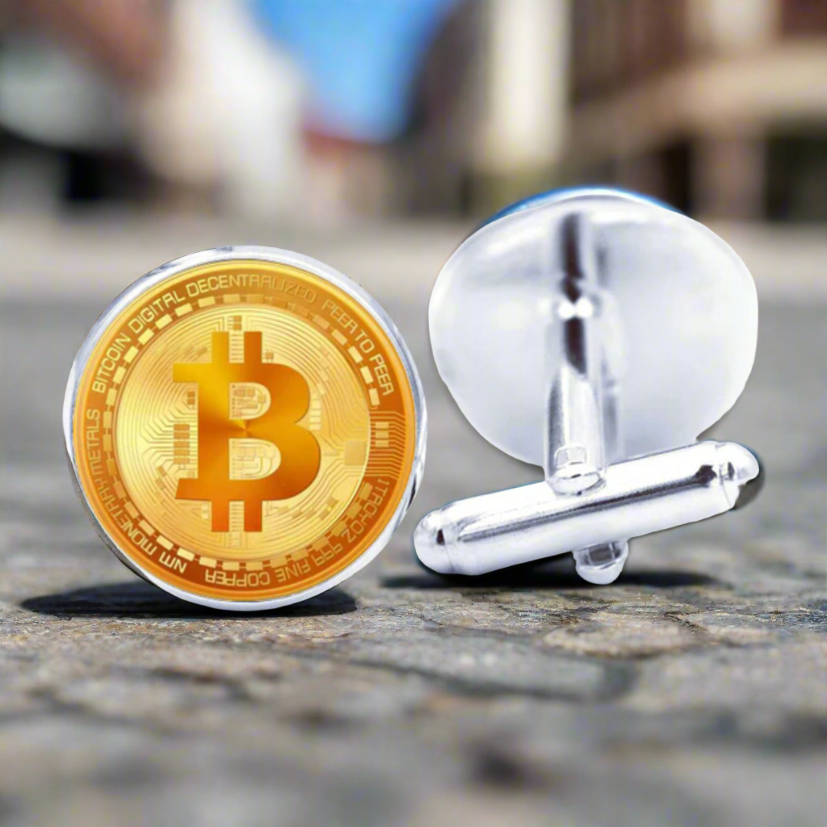 Bitcoin cufflinks displayed on a sleek black background, emphasizing their sophisticated appeal.