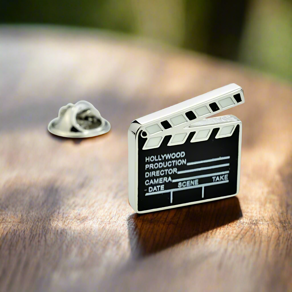 Close-up of a professional film festival lapel pin on a suit lapel