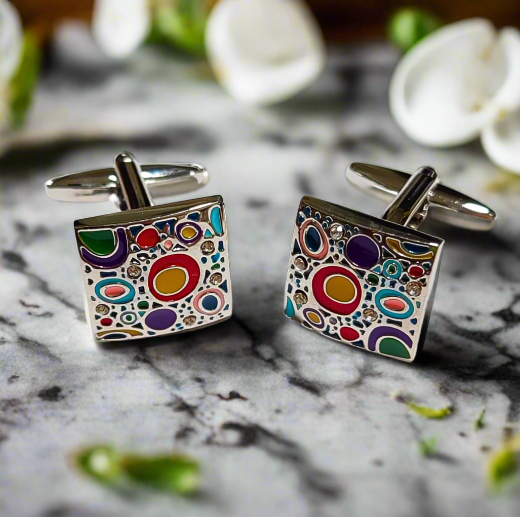 Close-up of colorful chromatic circles cufflinks on a formal shirt