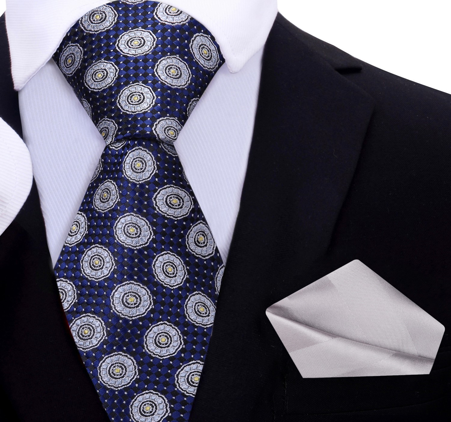 The silk tie displayed with a matching pocket square, ideal for weddings and formal occasions.