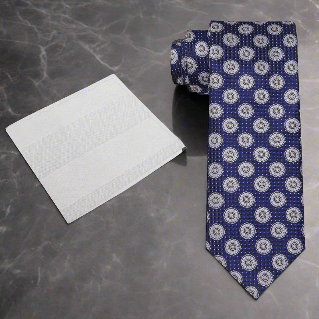 Close-up view of the blue and grey geometric silk tie, showcasing its intricate pattern.