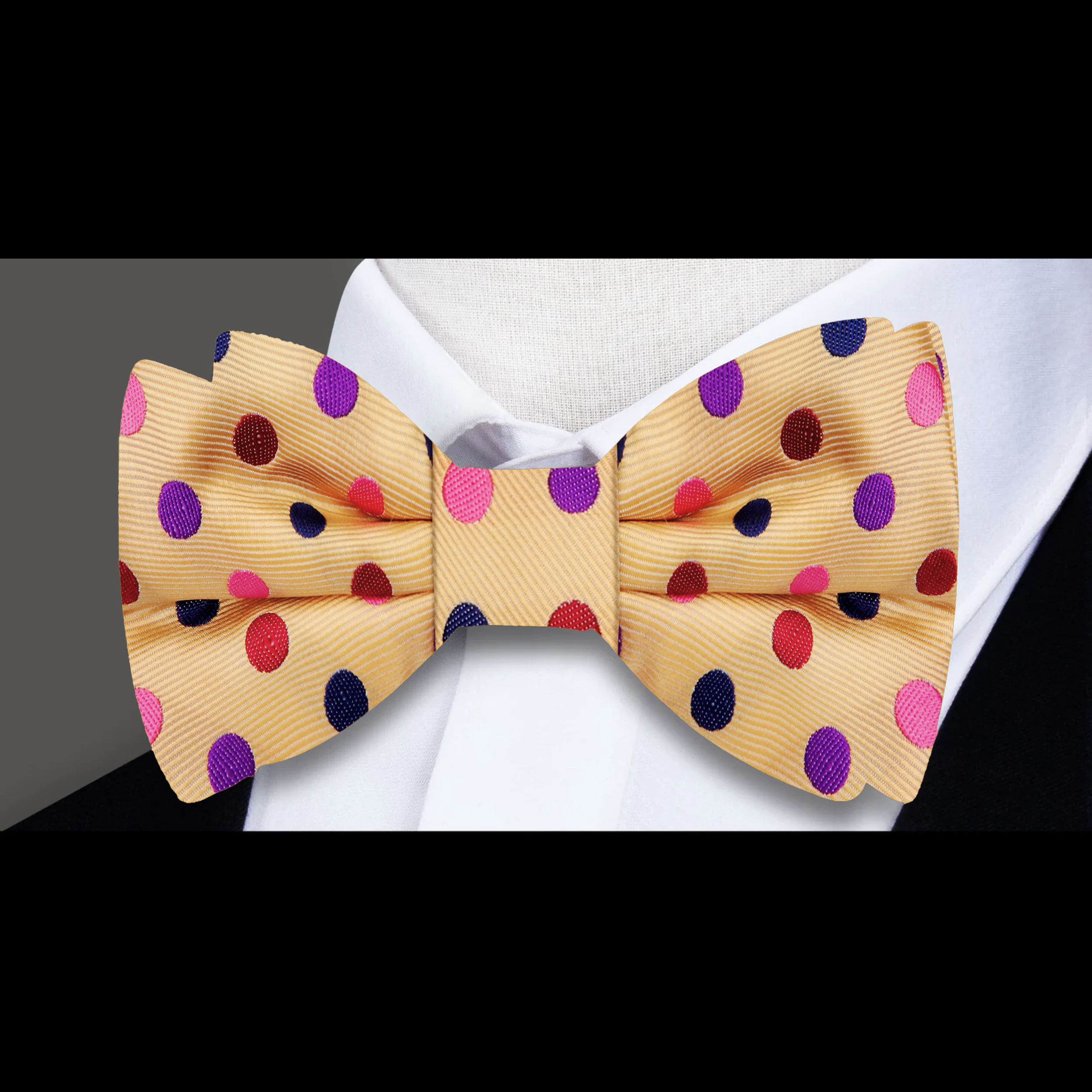Model wearing the Durnewood Blue Polka Dot Bow Tie with a navy suit at a wedding.
