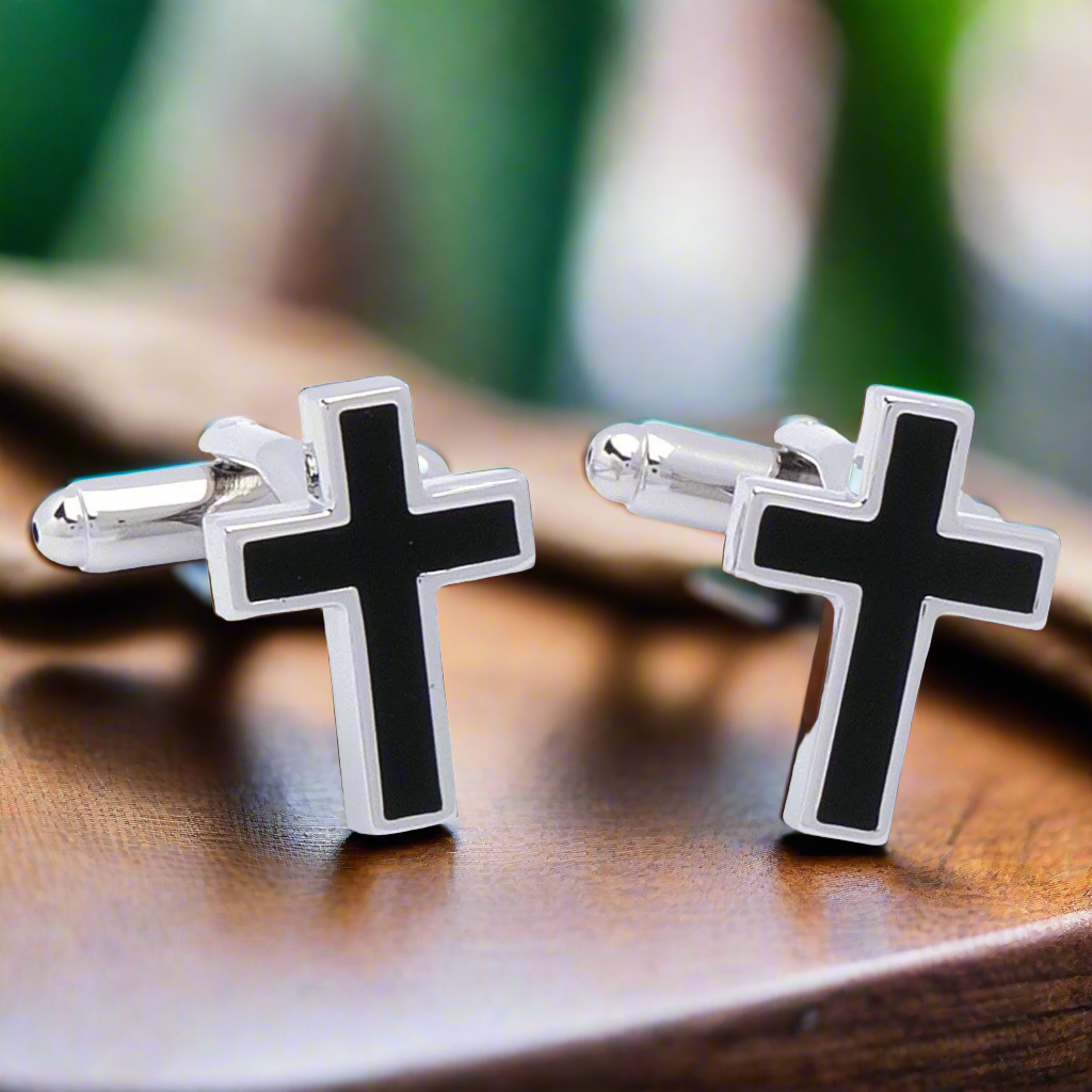Crucifix cufflinks worn with a formal shirt, emphasizing their elegance in a professional setting.