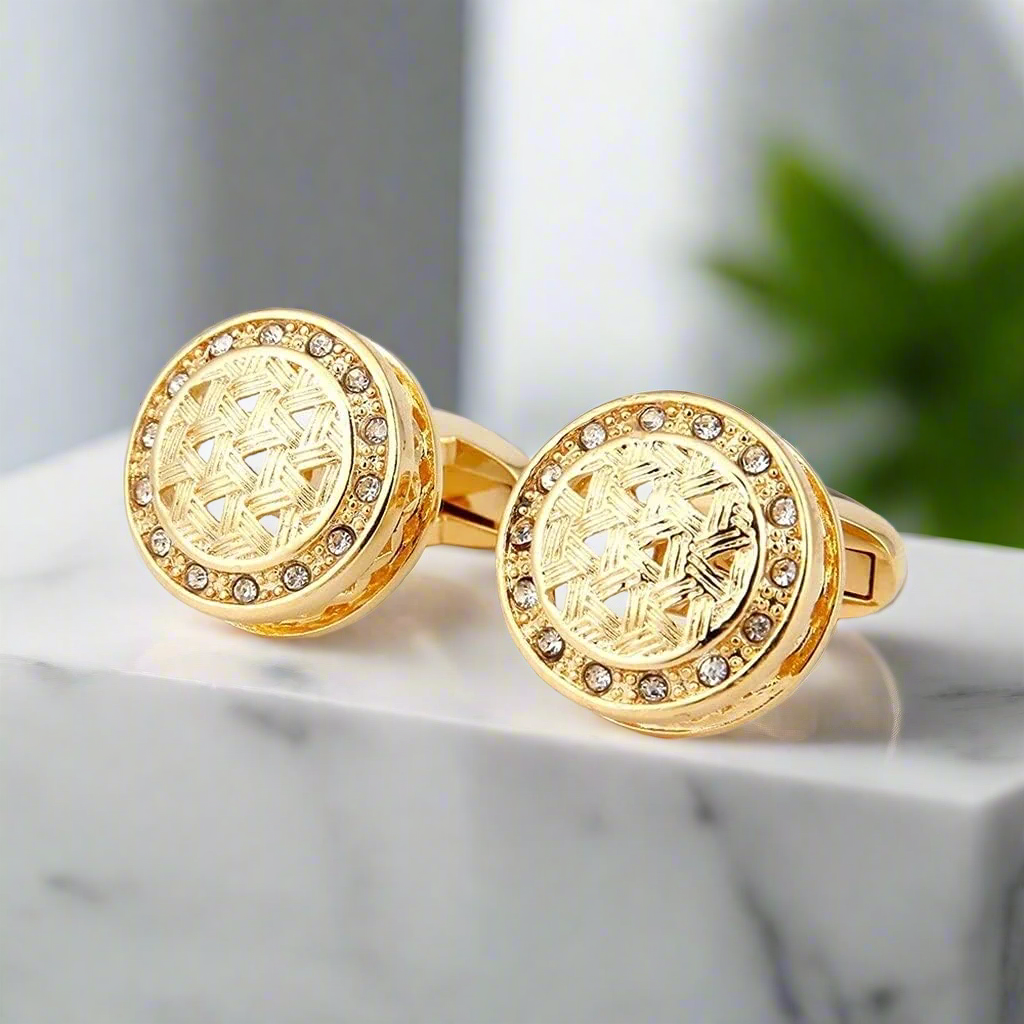 Regal gold cufflinks displayed on a crisp white dress shirt, highlighting their luxurious design.