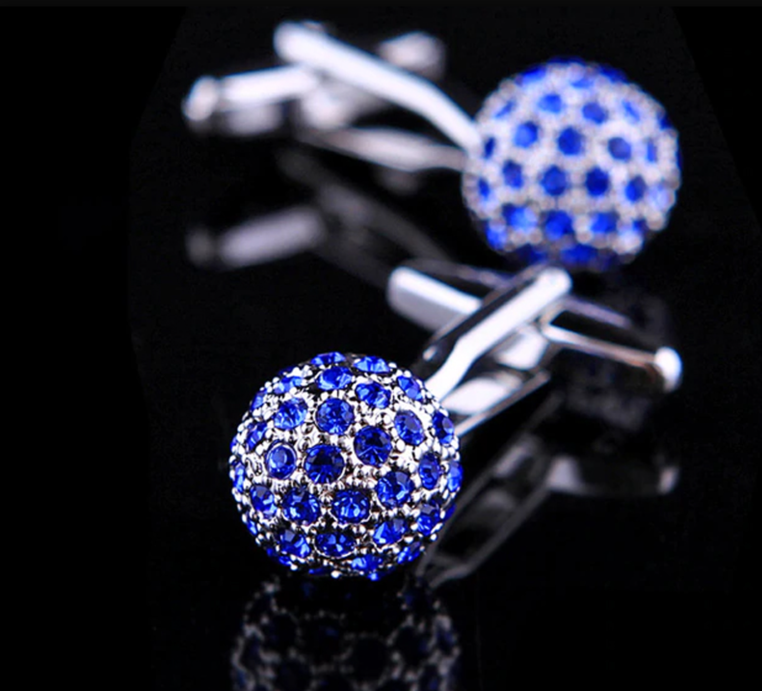 Styled shot of cufflinks for weddings with a dress shirt