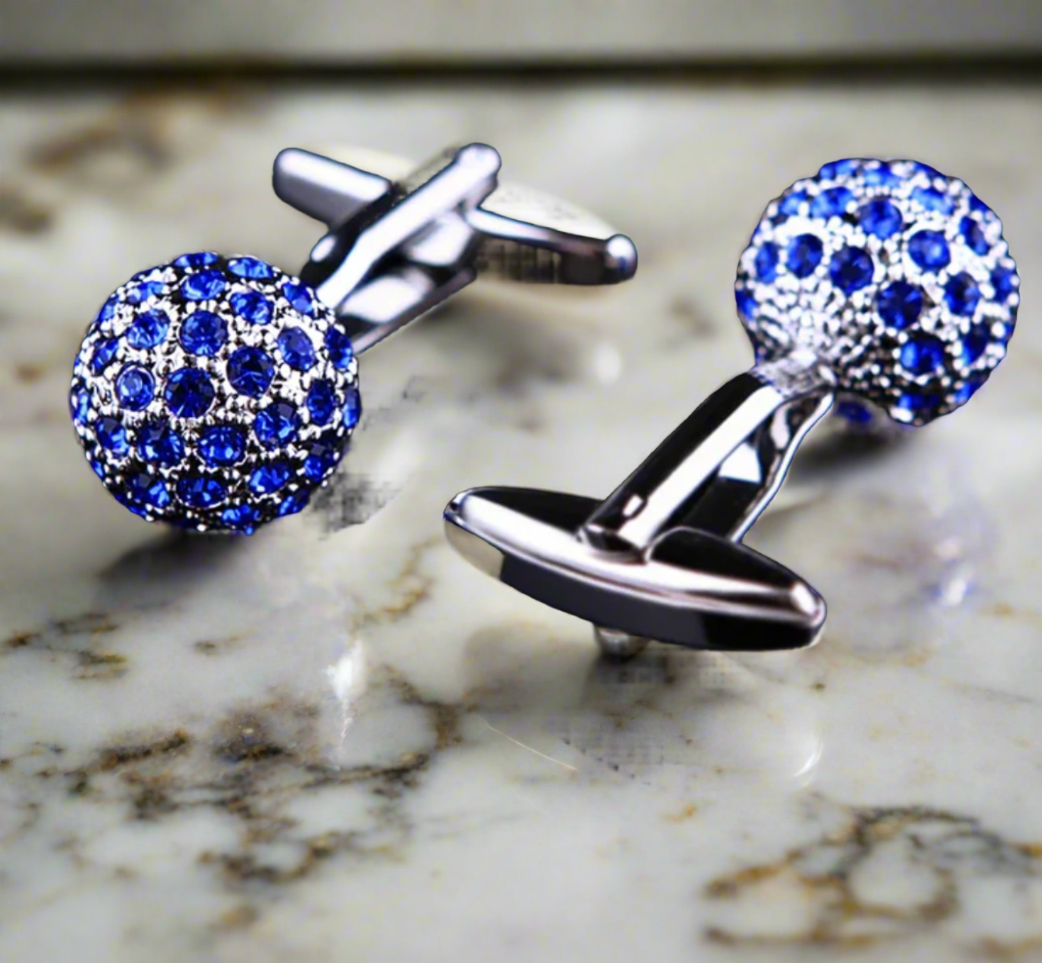 Front view of blue gem ball cufflinks with small stones for formal attire