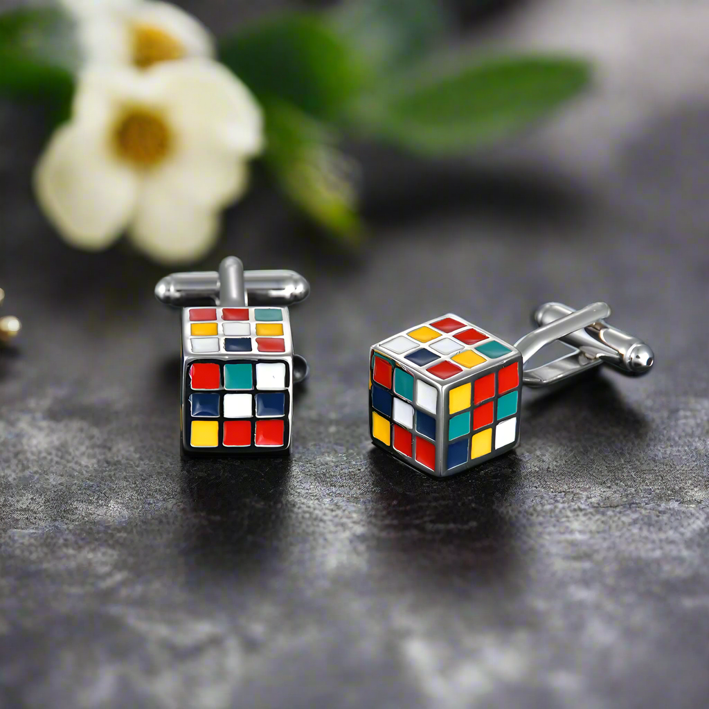 Stylish cufflinks showcased against a dark navy shirt, highlighting their colorful details.
