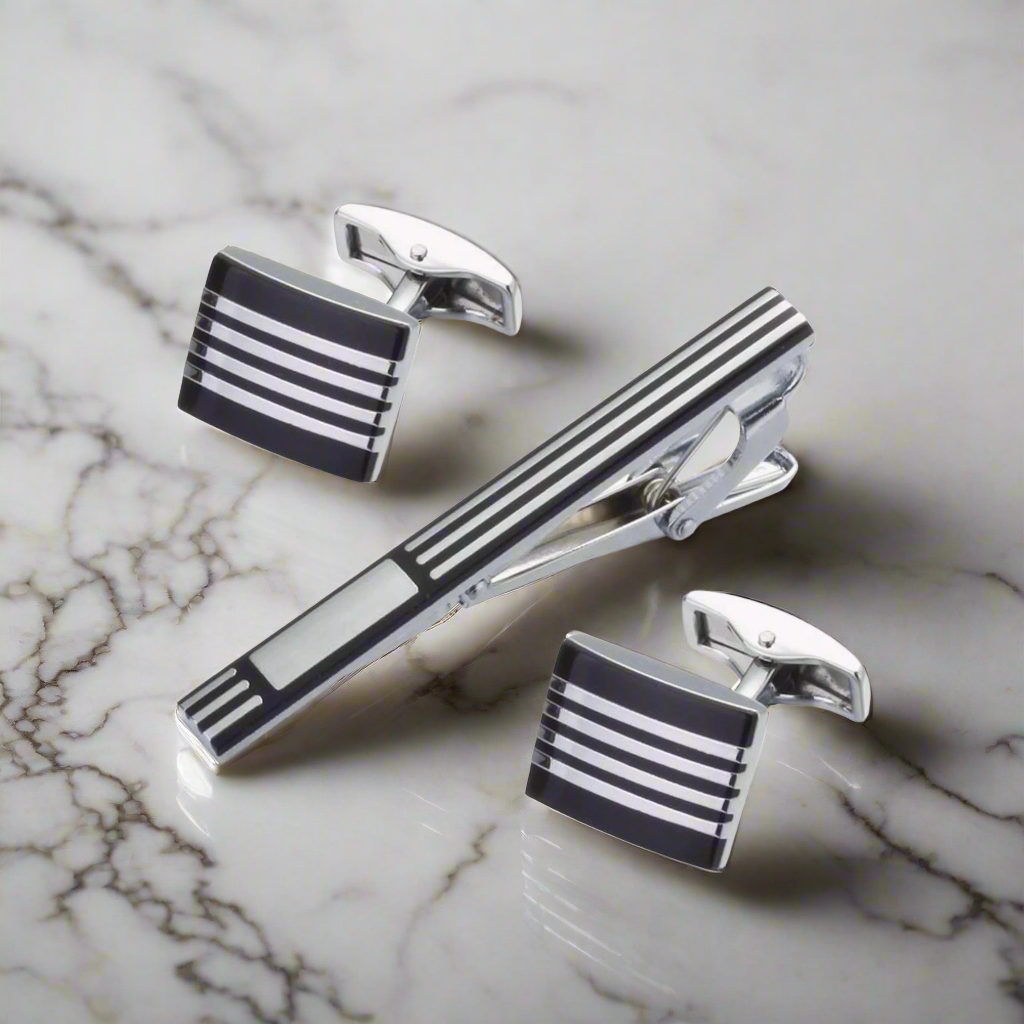 Close-up of men's cufflinks with chrome and black finish, stylish for formal wear