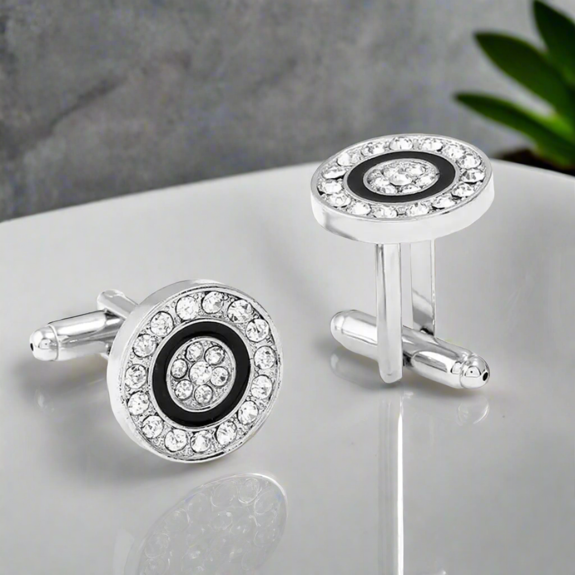 Front view of Cylinder Bling silver cufflinks on a white background, showcasing their round shape and sleek design