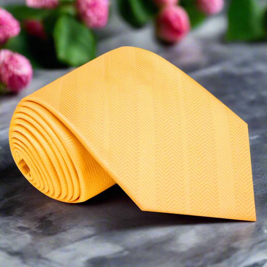 Vibrant dandelion yellow silk necktie draped elegantly on a wooden surface, perfect for weddings and formal events.