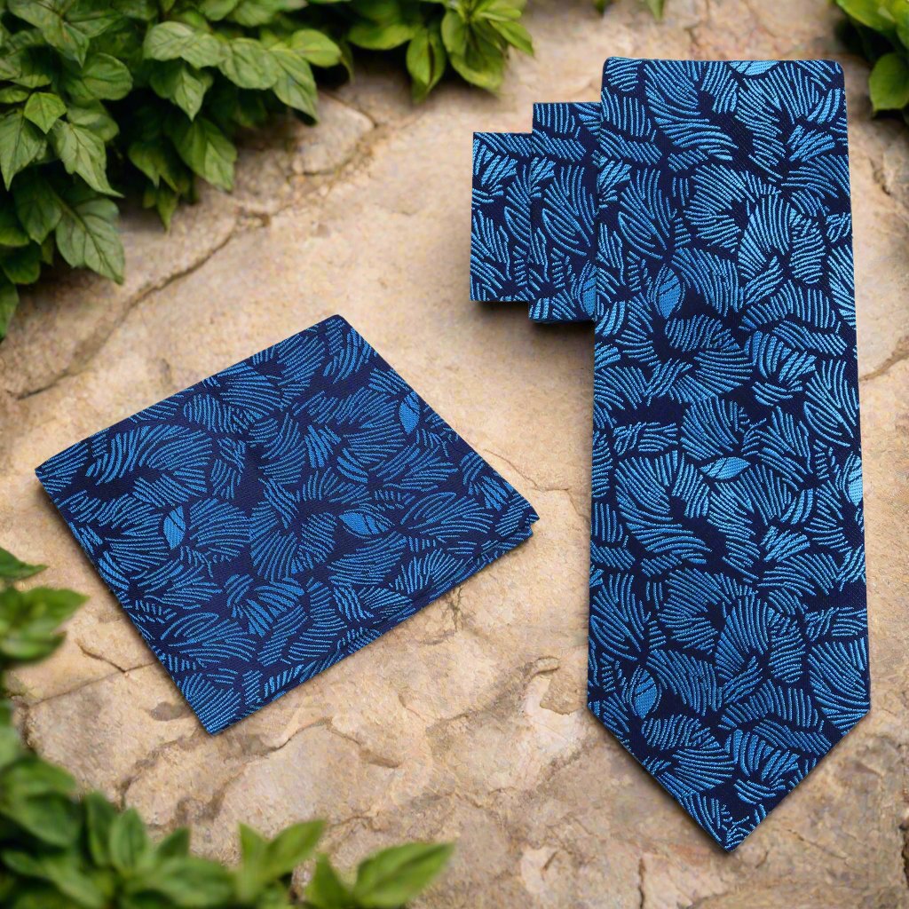 Man wearing a silk tie with tropical design at outdoor garden party