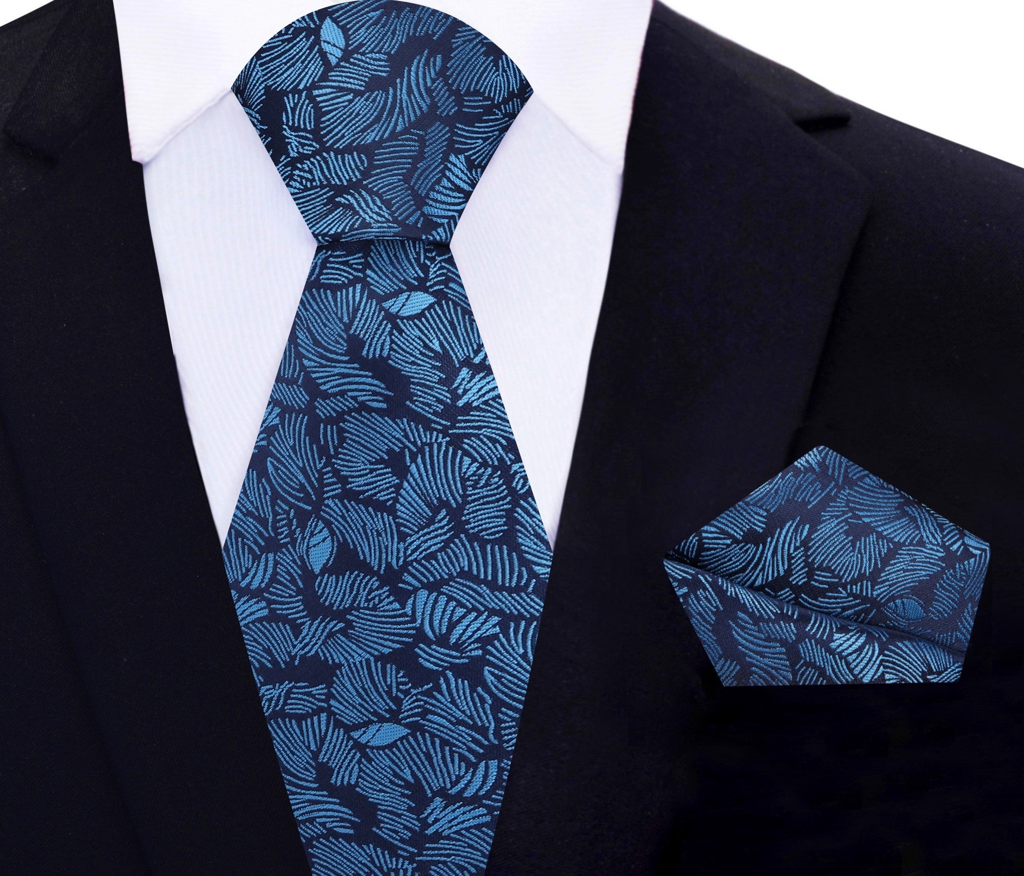 Man wearing a silk tie with tropical design at outdoor garden party