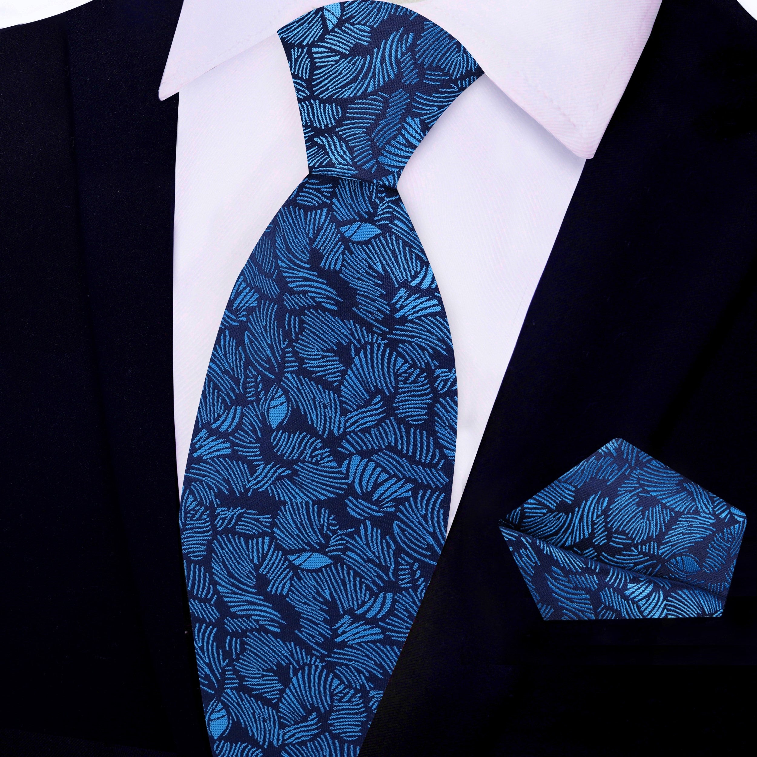 Light blue palm leaf tie for weddings with a navy suit