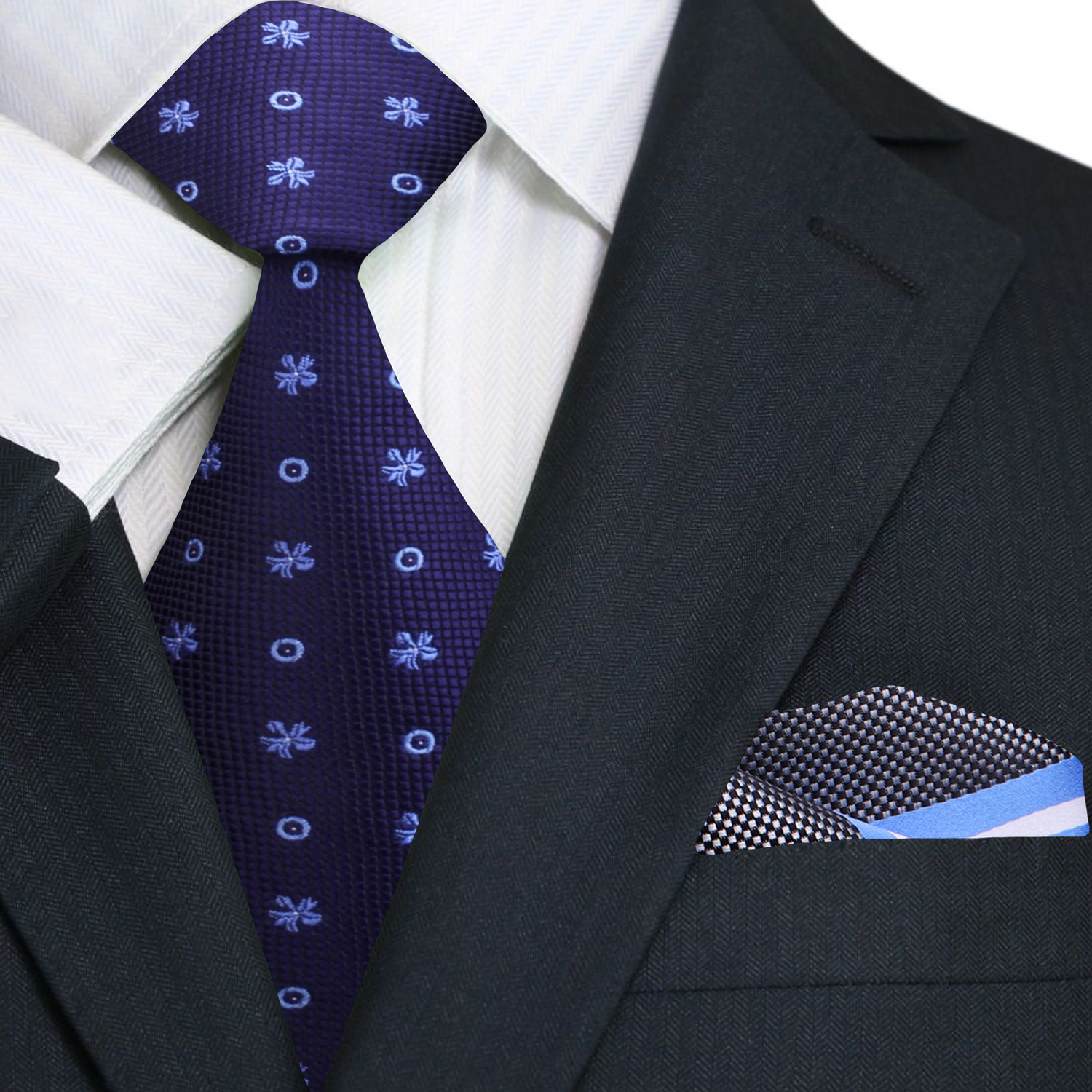 Close-up of the light blue bursts and dots on the dark blue tie.