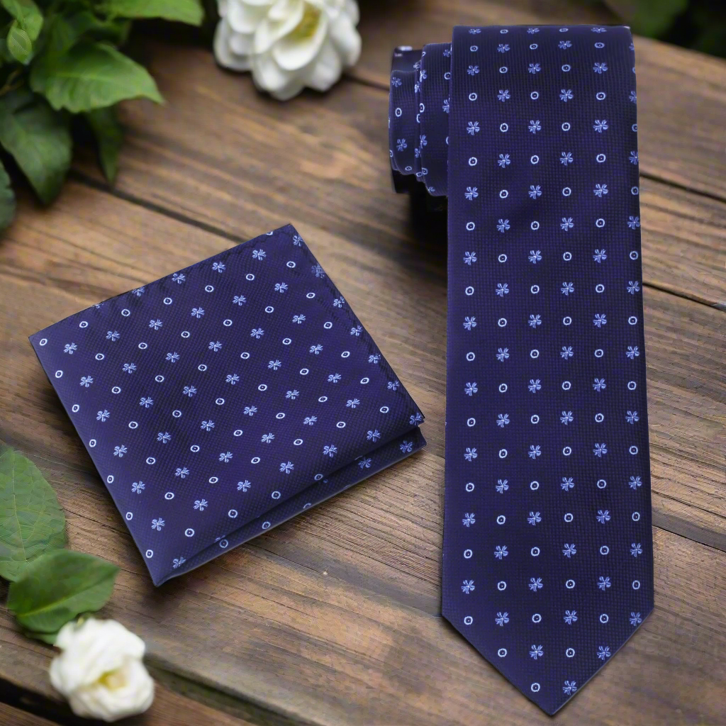 Close-up of the light blue bursts and dots on the dark blue tie.