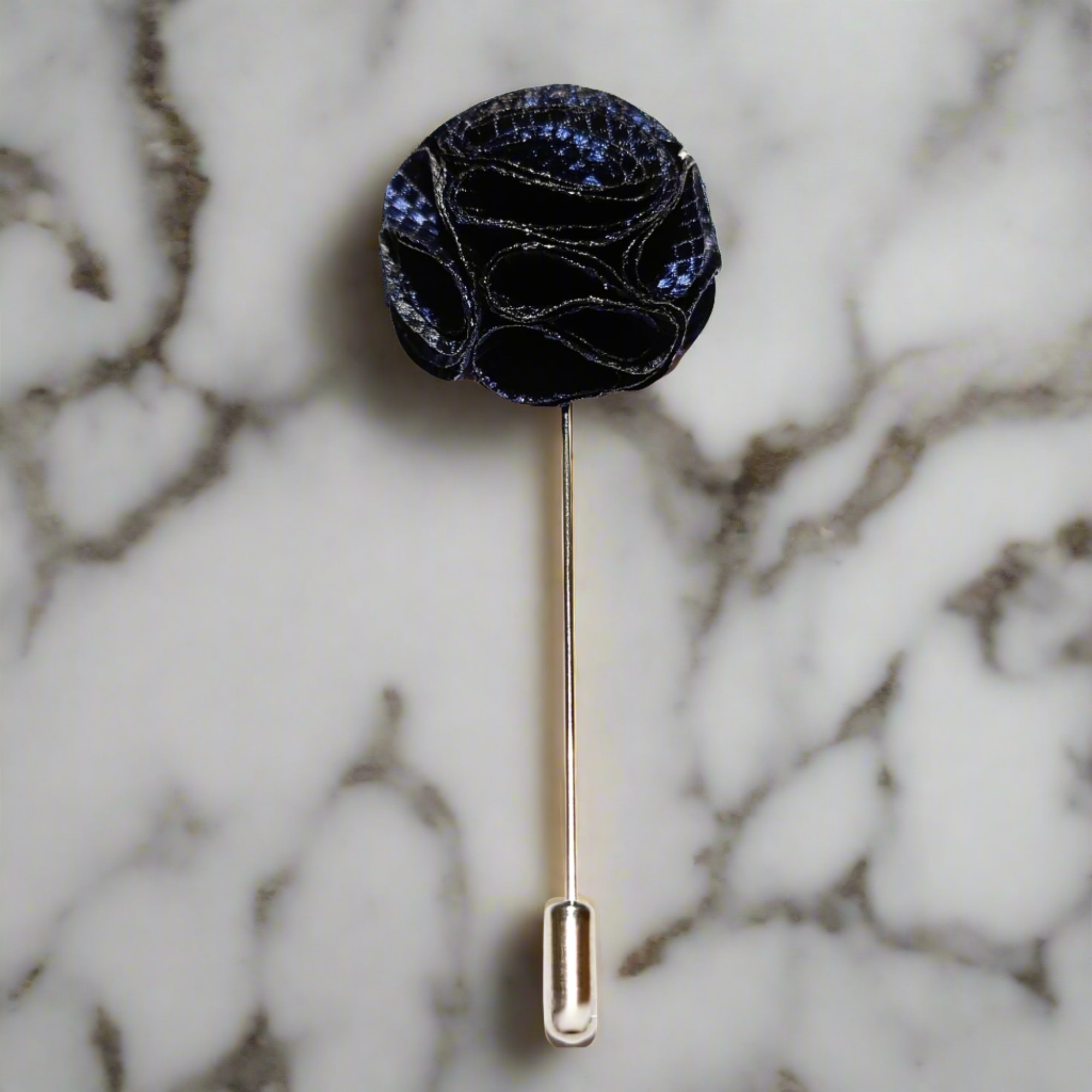 Close-up of a high-quality flower pin with textured fabric and zinc alloy backing