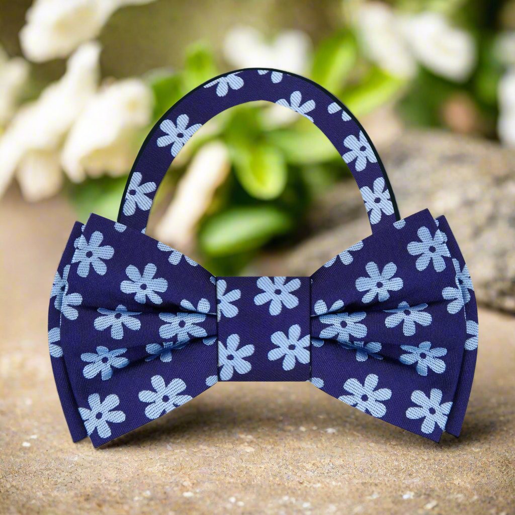 Elegant blue daisy silk bow tie showcasing floral design, perfect for spring events.