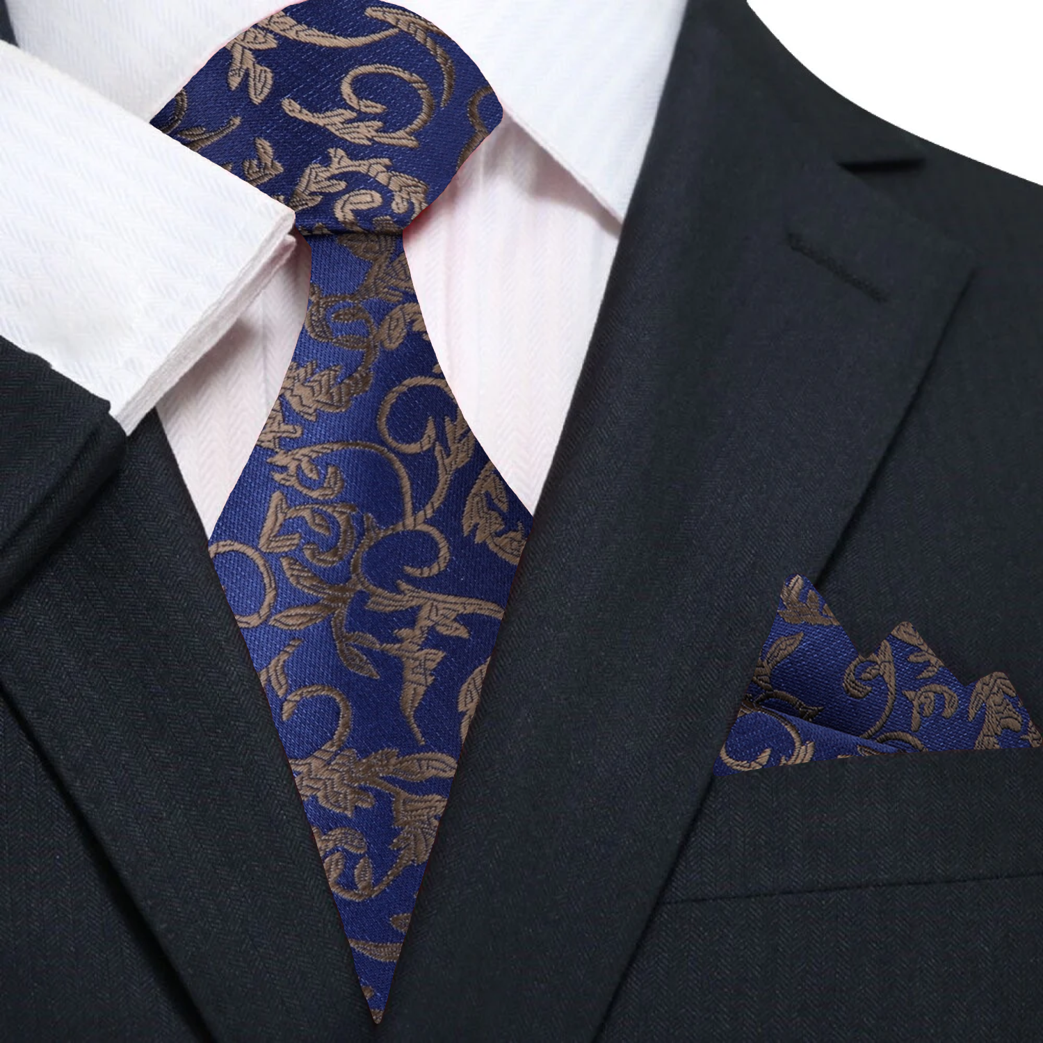 Close-up of dark blue silk necktie featuring intricate vine details.