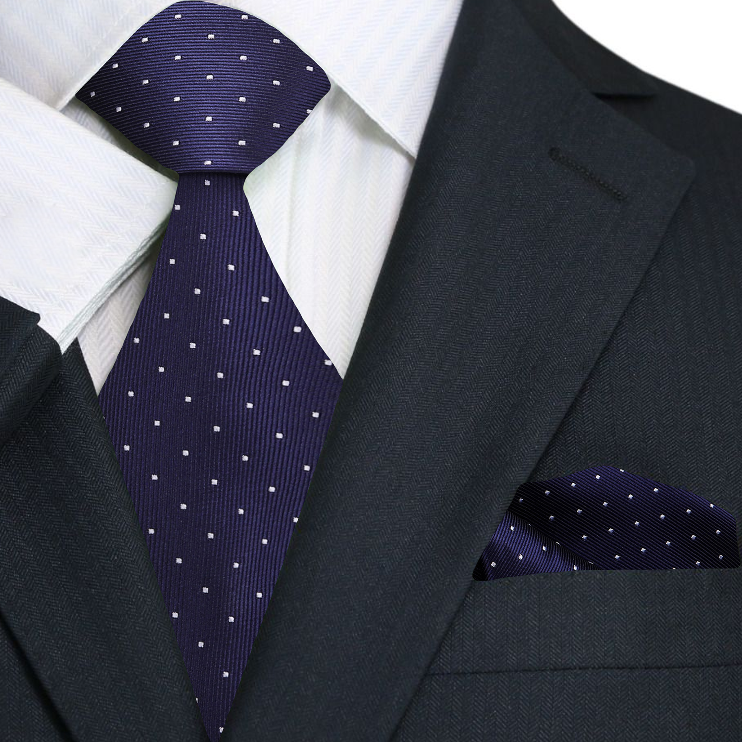 Man wearing a mens formal tie with polka dot pattern paired with white dress shirt and navy blazer