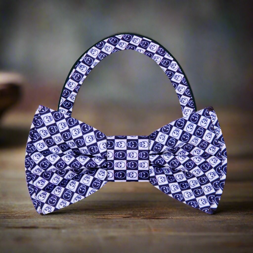 Close-up of the blue skull bow tie highlighting the intricate geometric design against a navy suit.