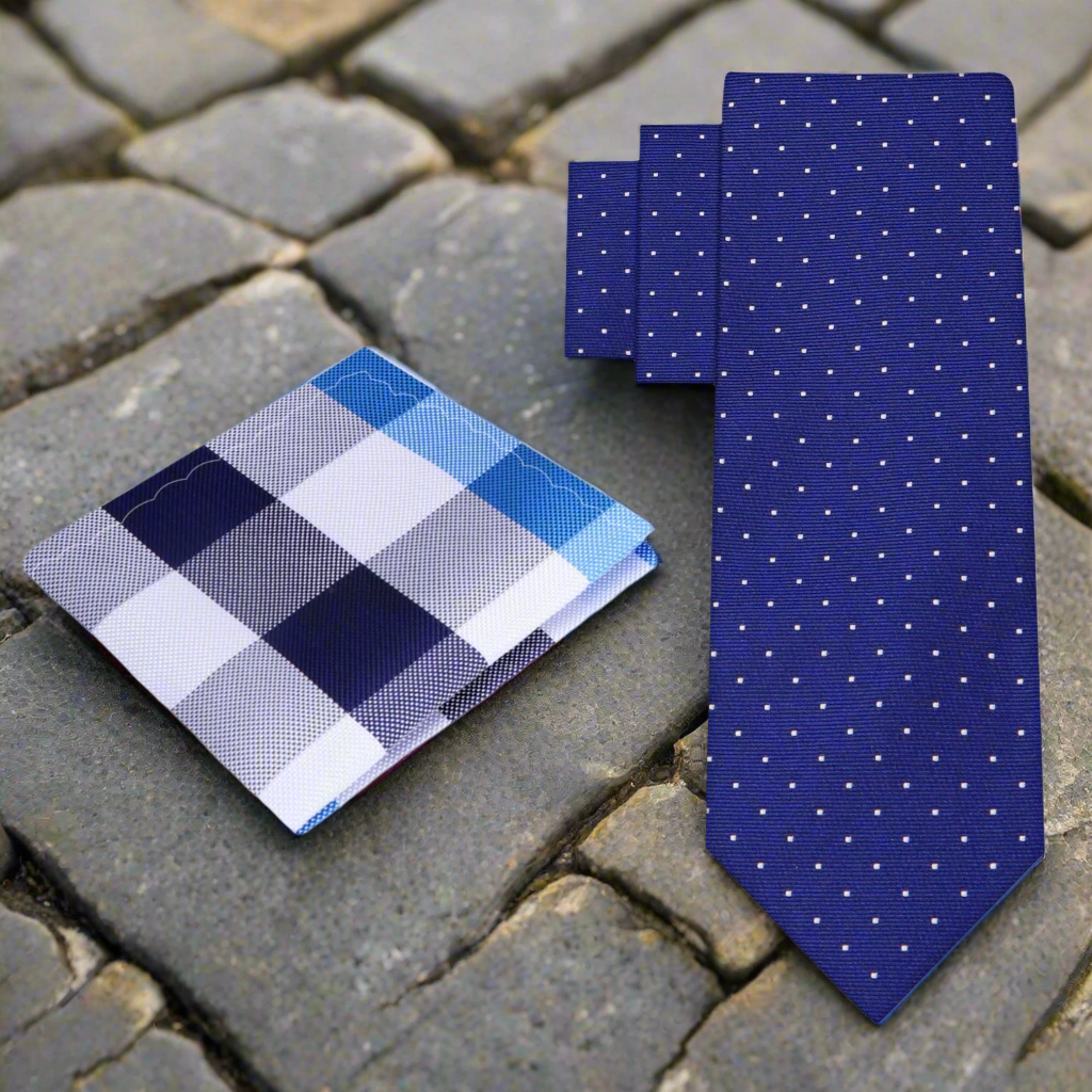 Styled outfit with dark blue silk necktie, white dress shirt, and charcoal suit for a business setting