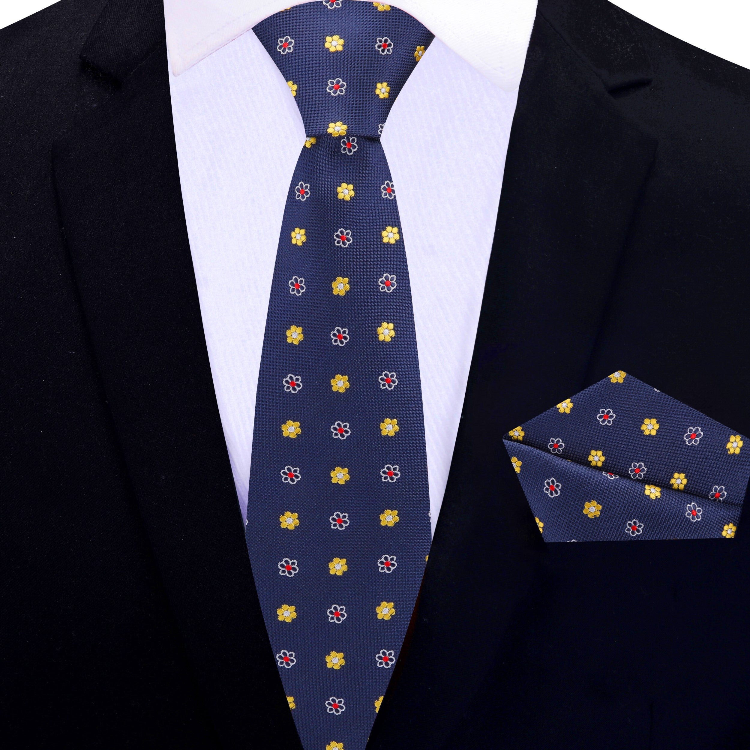 The Blue Floral Necktie with Pocket Square Set displayed alongside a light grey suit for a stylish ensemble.