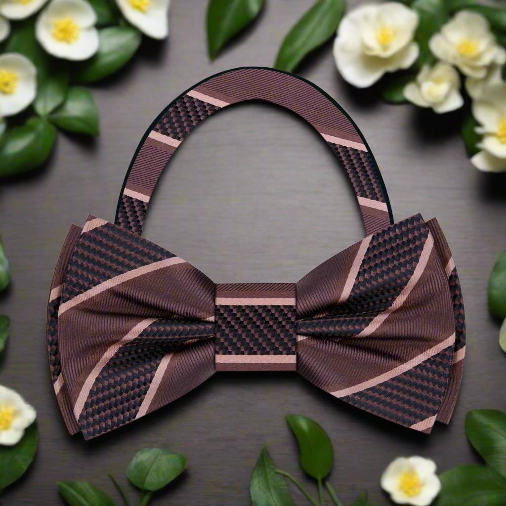 Model wearing a silk striped bow tie with a navy suit for a formal event