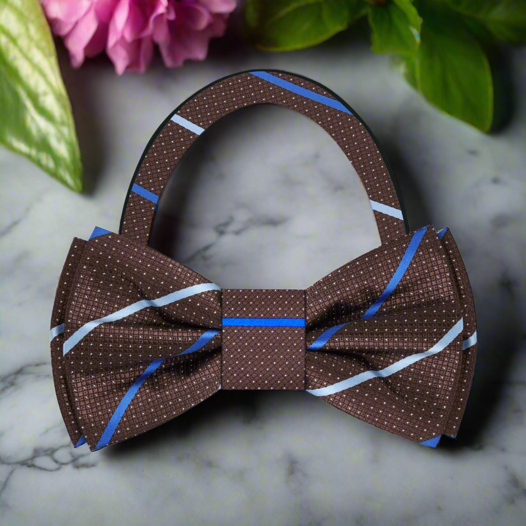 Close-up view of a dark blue silk bow tie with a brown stripe pattern, ideal for weddings
