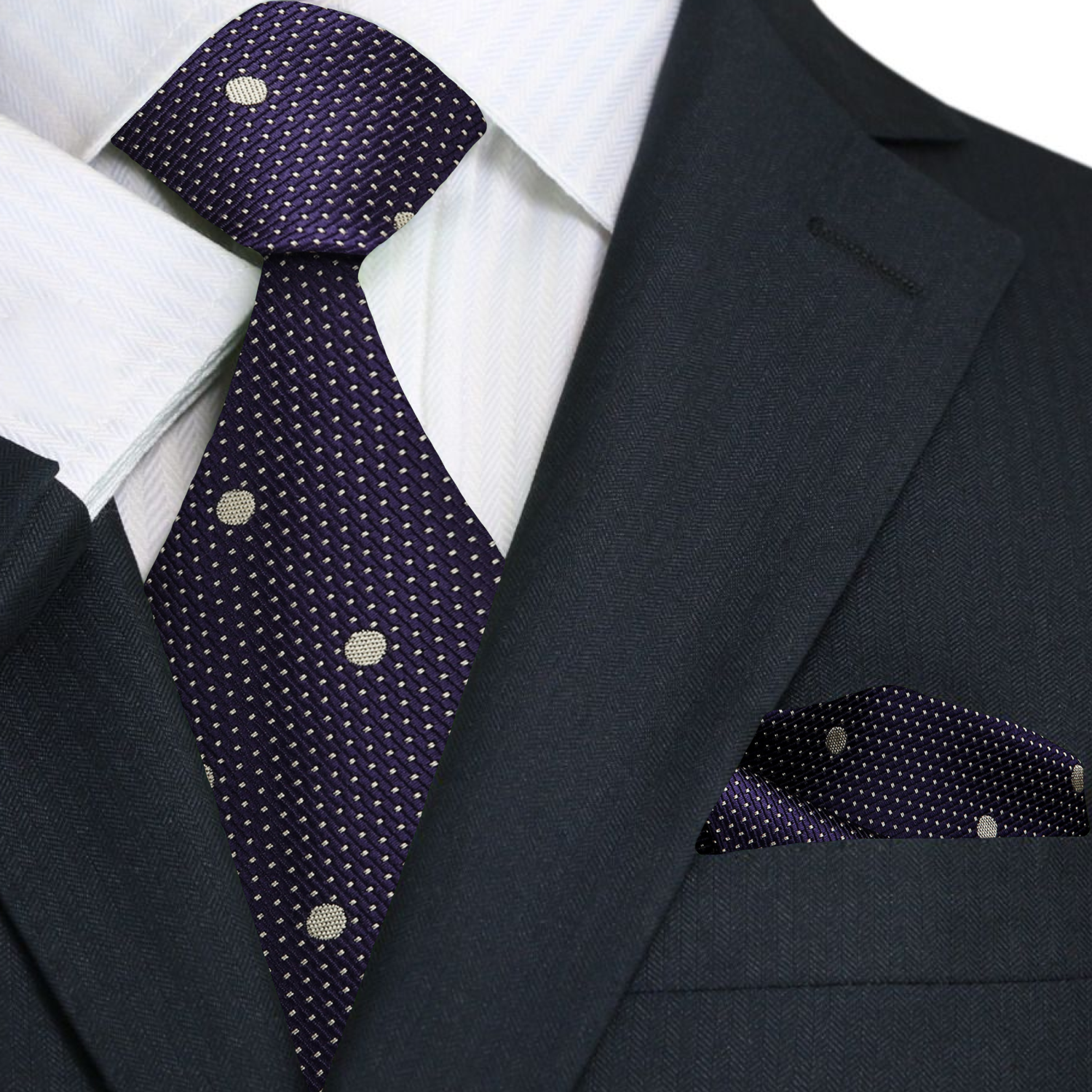 Elegant blackened purple silk necktie with pale gold polka dots, displayed on a white background.
