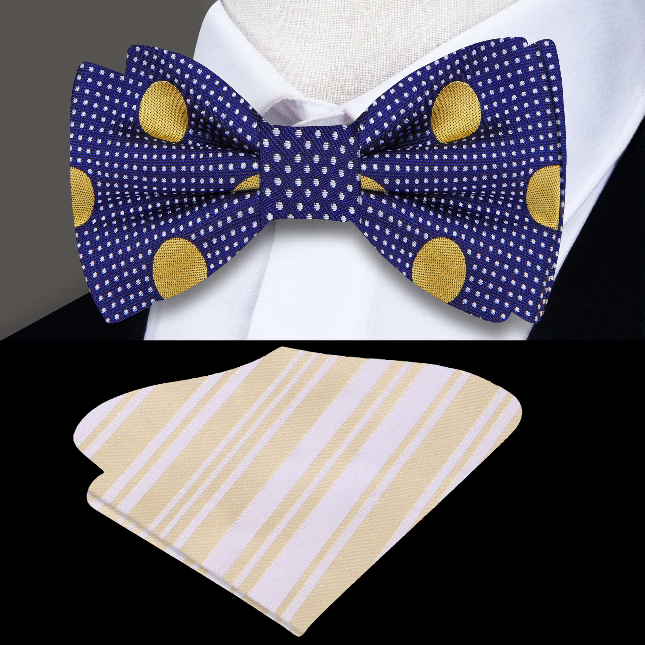 Elegant dark blue bow tie with gold polka dots displayed on a light grey dress shirt.