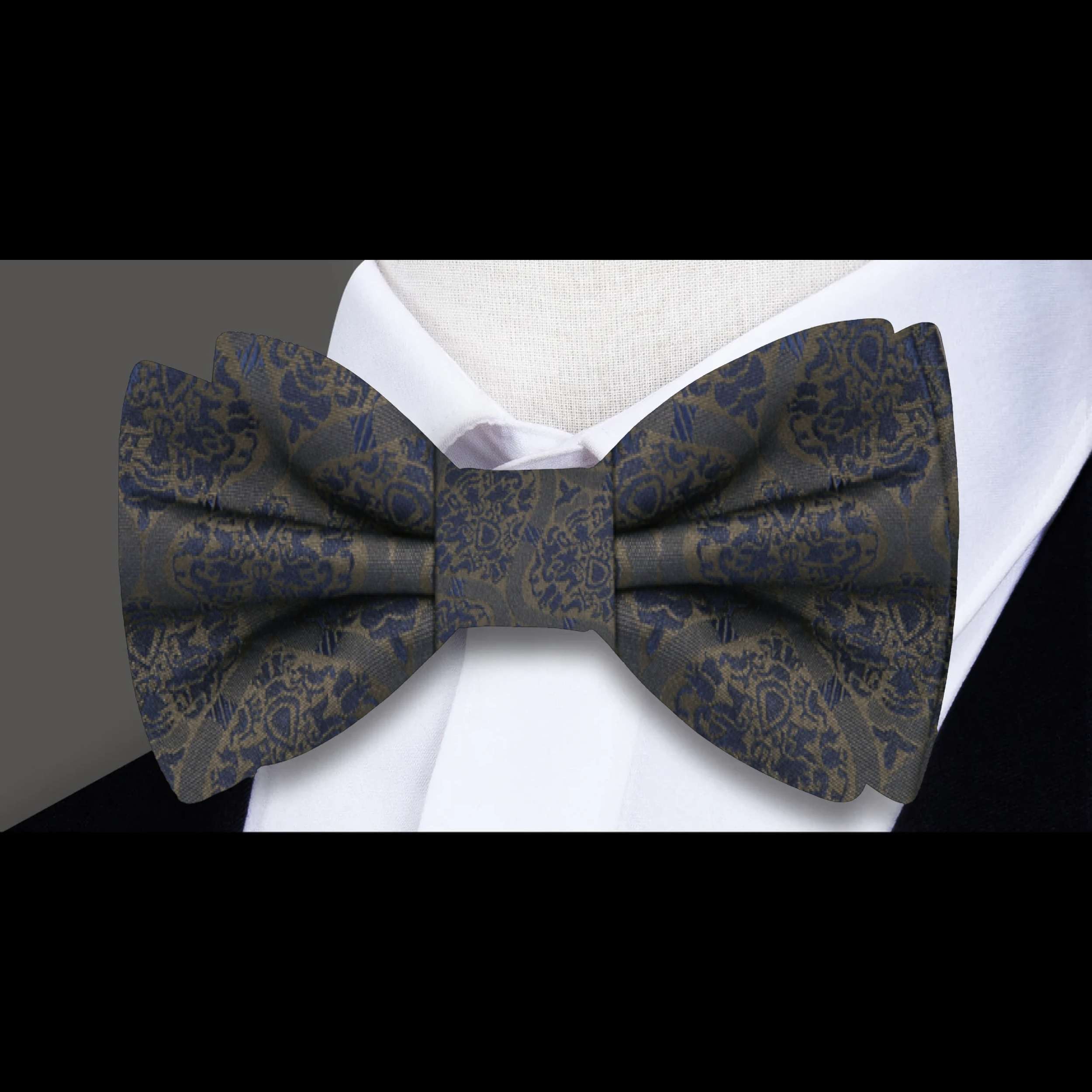 Model wearing the abstract silk bow tie at a wedding, styled with a crisp white dress shirt.