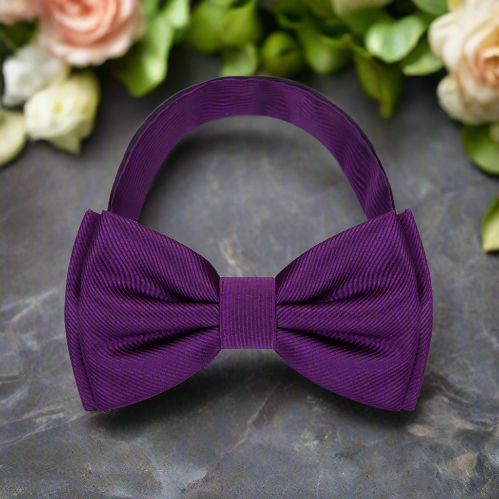 Classic solid color bow tie in royal blue, perfect for formal events.