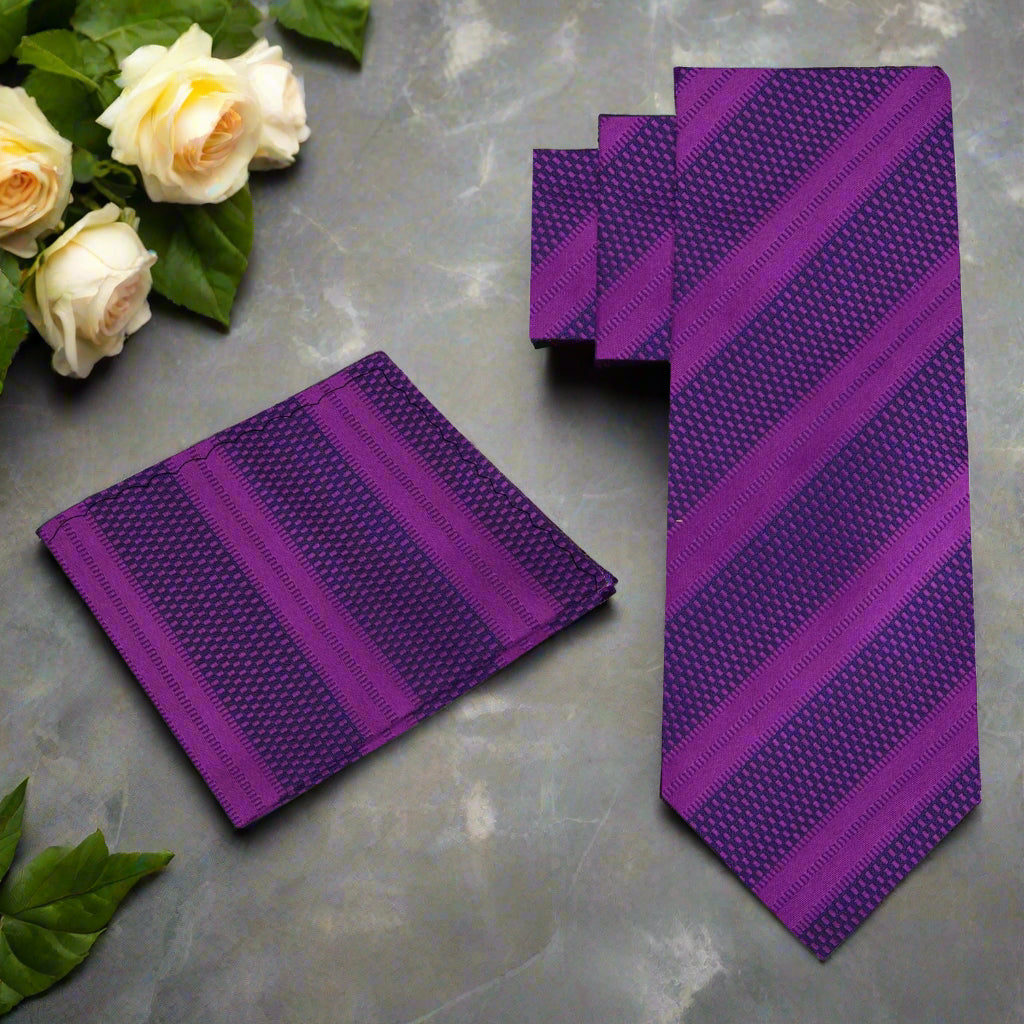 Styled dark purple necktie paired with a crisp white dress shirt for professional attire.