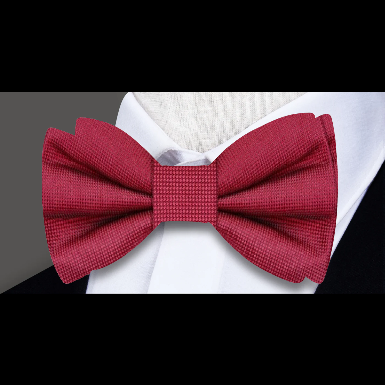 Self-tie bow tie in classic black, suited for tuxedos.